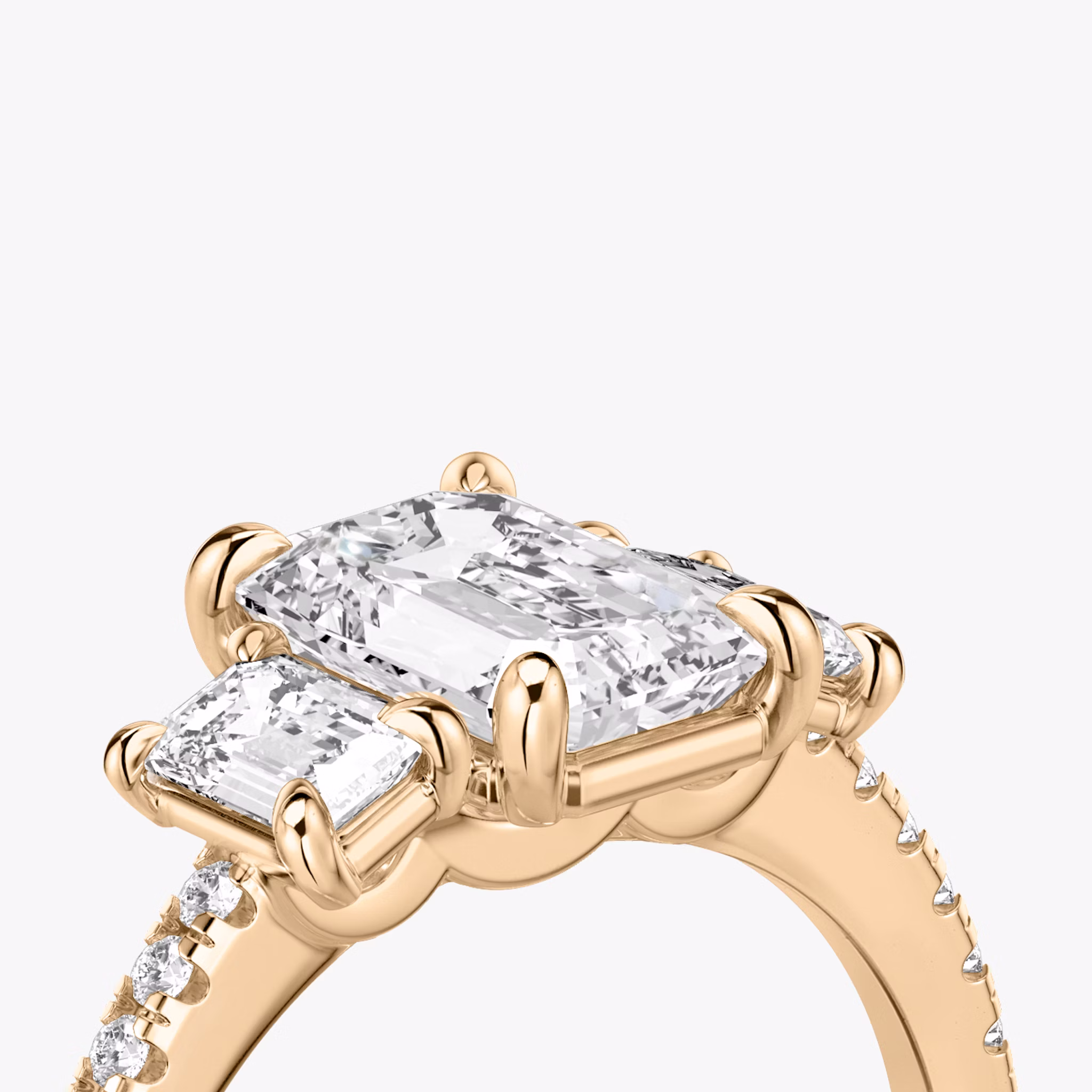 The Three Stone | Emerald | 14k | Rose Gold | bandAccent: Pavé | sideStoneCarat: 0.25ct | sideStoneShape: Emerald | diamondOrientation: vertical | caratWeight: other