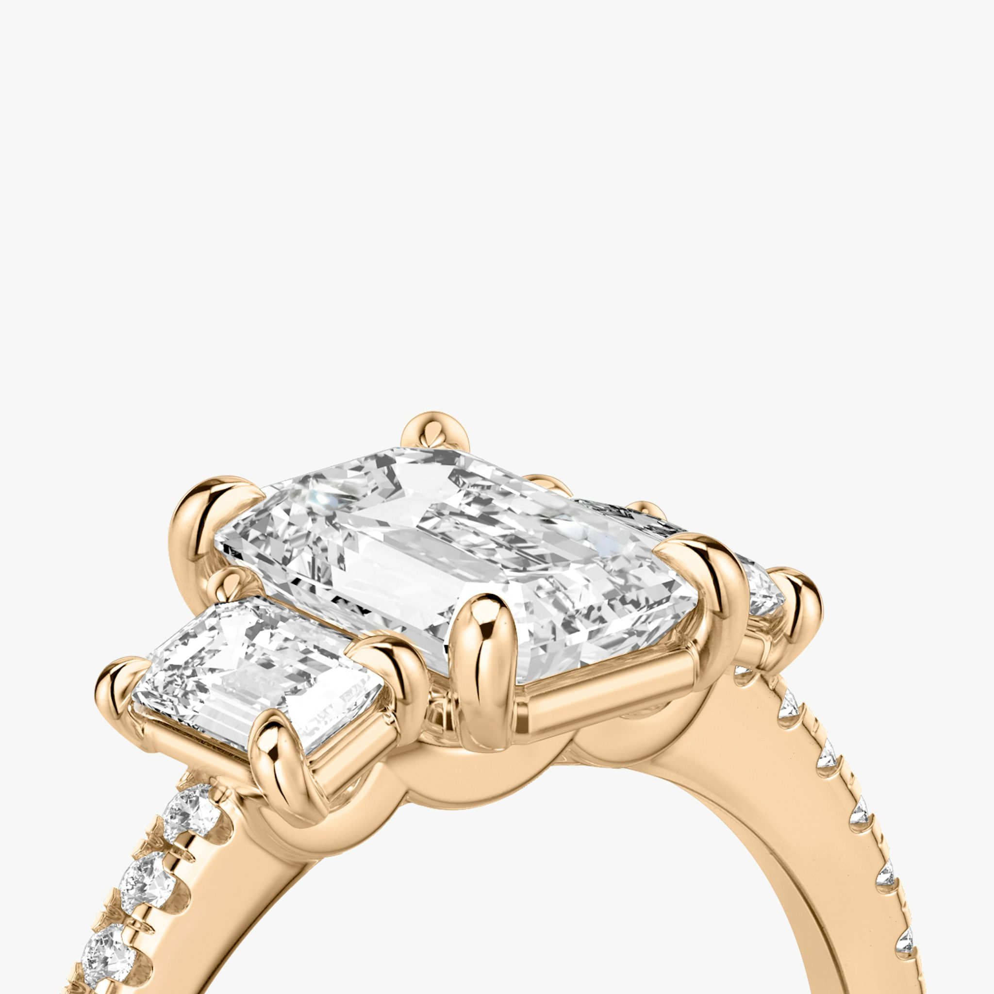 The Three Stone | Emerald | 14k | Rose Gold | bandAccent: Pavé | sideStoneCarat: 0.25ct | sideStoneShape: Emerald | diamondOrientation: vertical | caratWeight: other