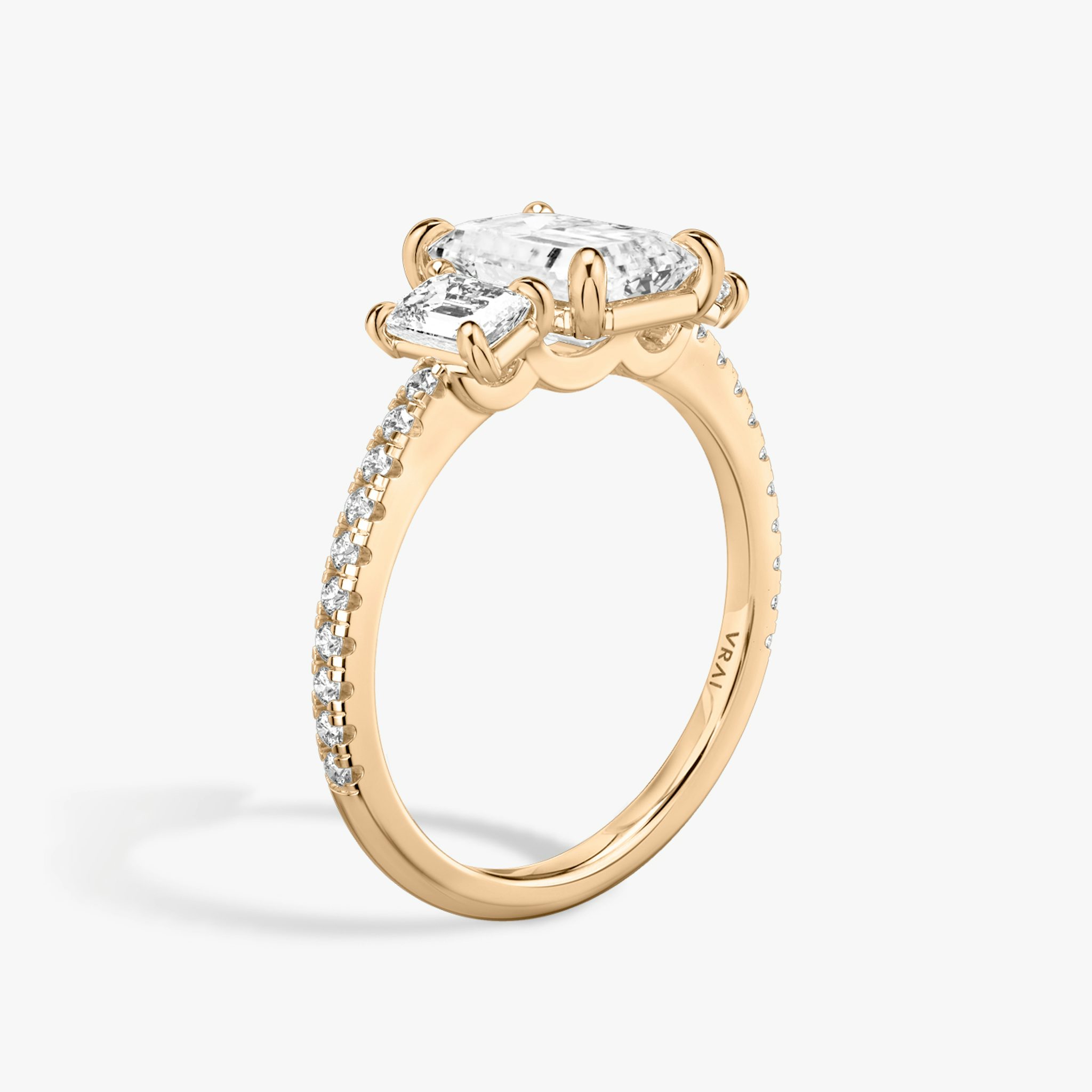 The Three Stone | Emerald | 14k | Rose Gold | bandAccent: Pavé | sideStoneCarat: 0.25ct | sideStoneShape: Emerald | diamondOrientation: vertical | caratWeight: other