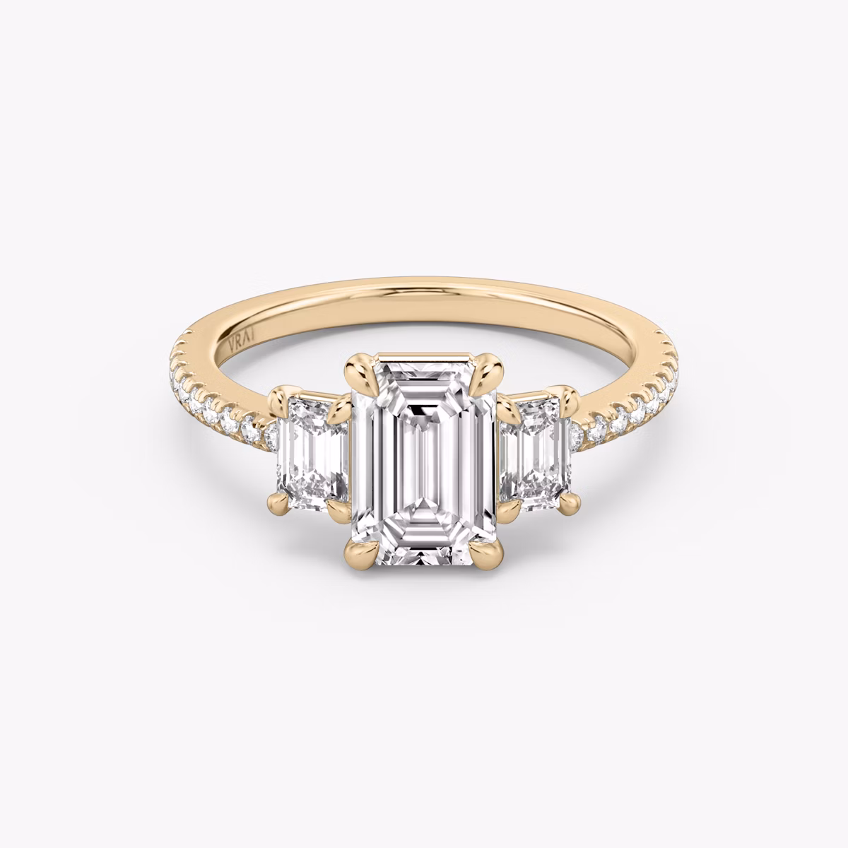 The Three Stone | Emerald | 14k | Rose Gold | bandAccent: Pavé | sideStoneCarat: 0.25ct | sideStoneShape: Emerald | diamondOrientation: vertical | caratWeight: other