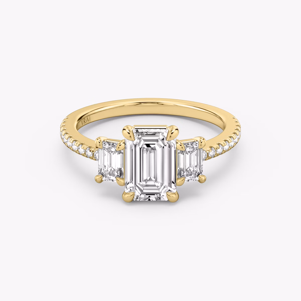 The Three Stone | Emerald | 18k | Yellow Gold | bandAccent: Pavé | sideStoneCarat: 0.25ct | sideStoneShape: Emerald | diamondOrientation: vertical | caratWeight: other