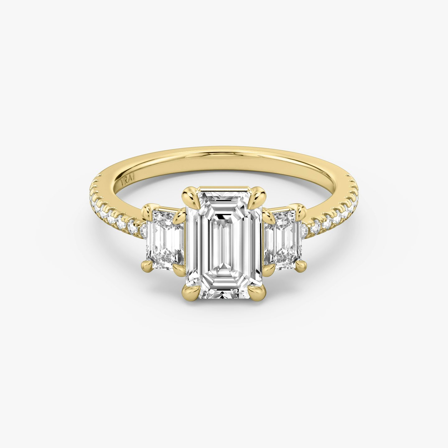 The Three Stone | Emerald | 18k | Yellow Gold | bandAccent: Pavé | sideStoneCarat: 0.25ct | sideStoneShape: Emerald | diamondOrientation: vertical | caratWeight: other