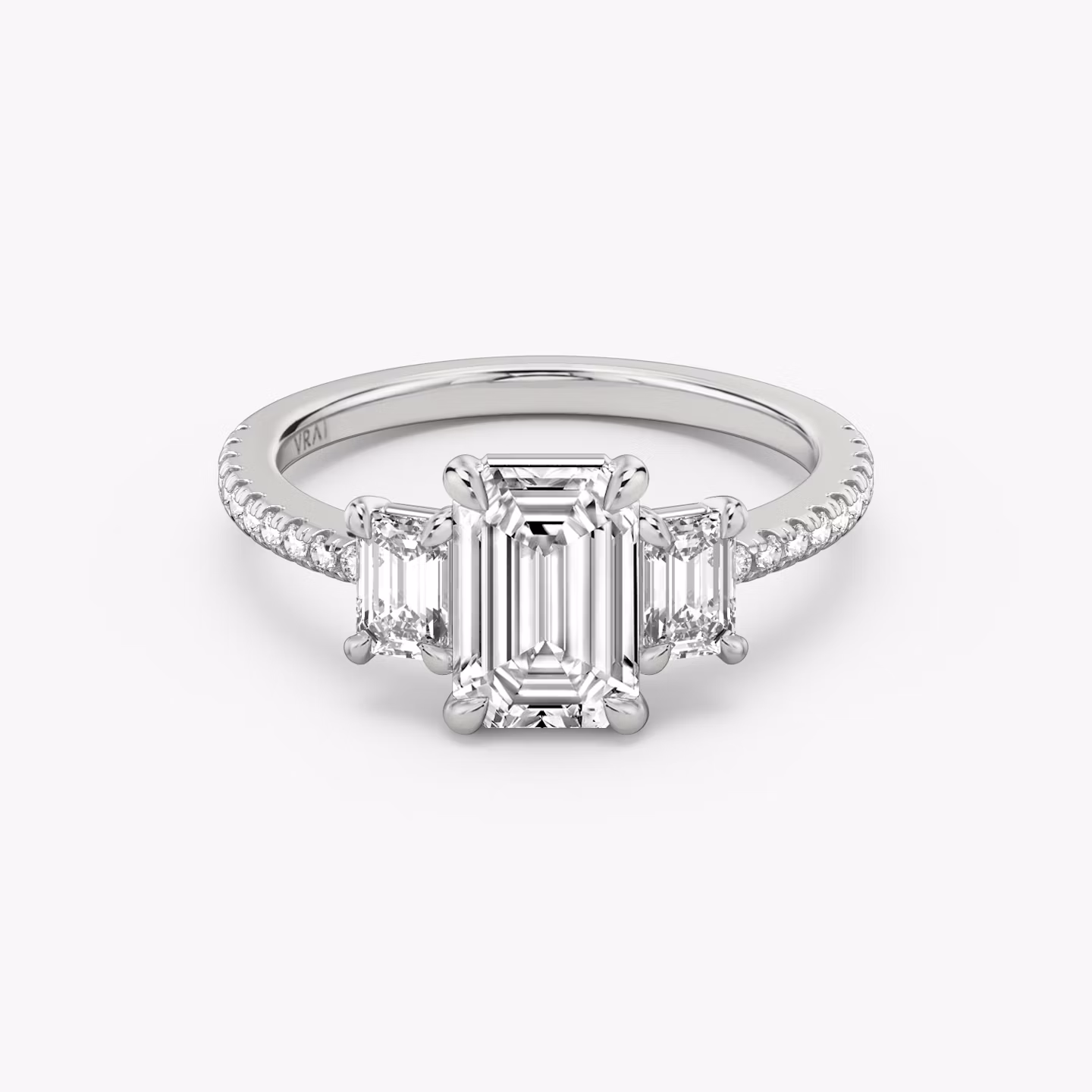 The Three Stone | Emerald | 18k | White Gold | bandAccent: Pavé | sideStoneCarat: 0.25ct | sideStoneShape: Emerald | diamondOrientation: vertical | caratWeight: other