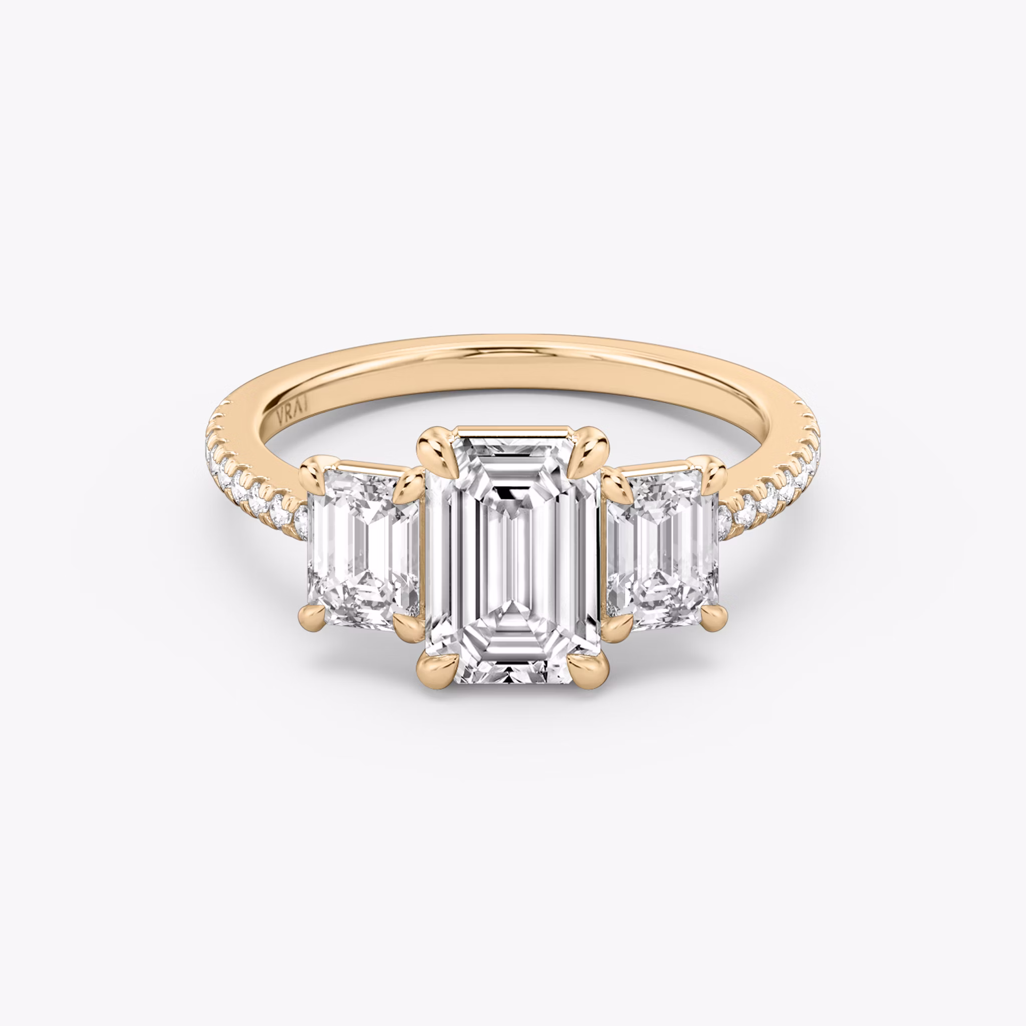The Three Stone | Emerald | 14k | Rose Gold | bandAccent: Pavé | sideStoneCarat: 0.50ct | sideStoneShape: Emerald | diamondOrientation: vertical | caratWeight: other
