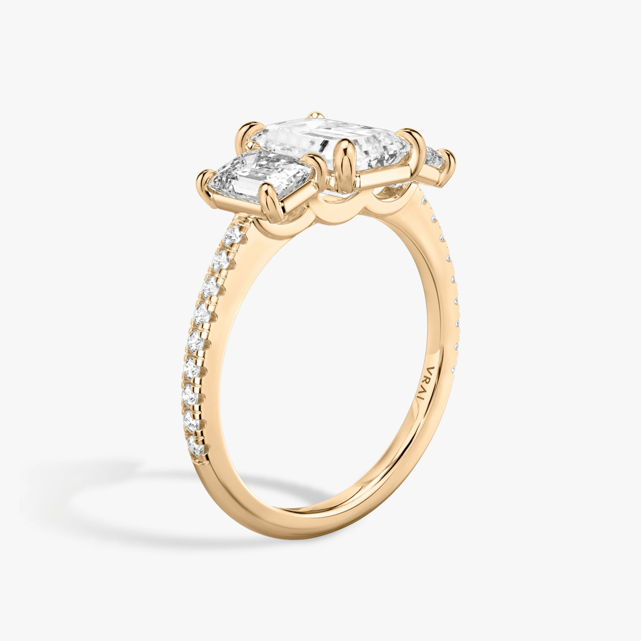 The Three Stone | Emerald | 14k | Rose Gold | bandAccent: Pavé | sideStoneCarat: 0.50ct | sideStoneShape: Emerald | diamondOrientation: vertical | caratWeight: other