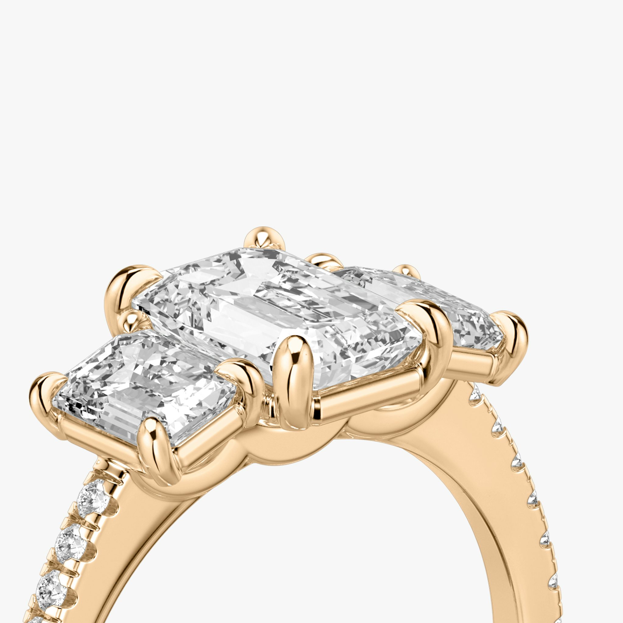 The Three Stone | Emerald | 14k | Rose Gold | bandAccent: Pavé | sideStoneCarat: 0.50ct | sideStoneShape: Emerald | diamondOrientation: vertical | caratWeight: other