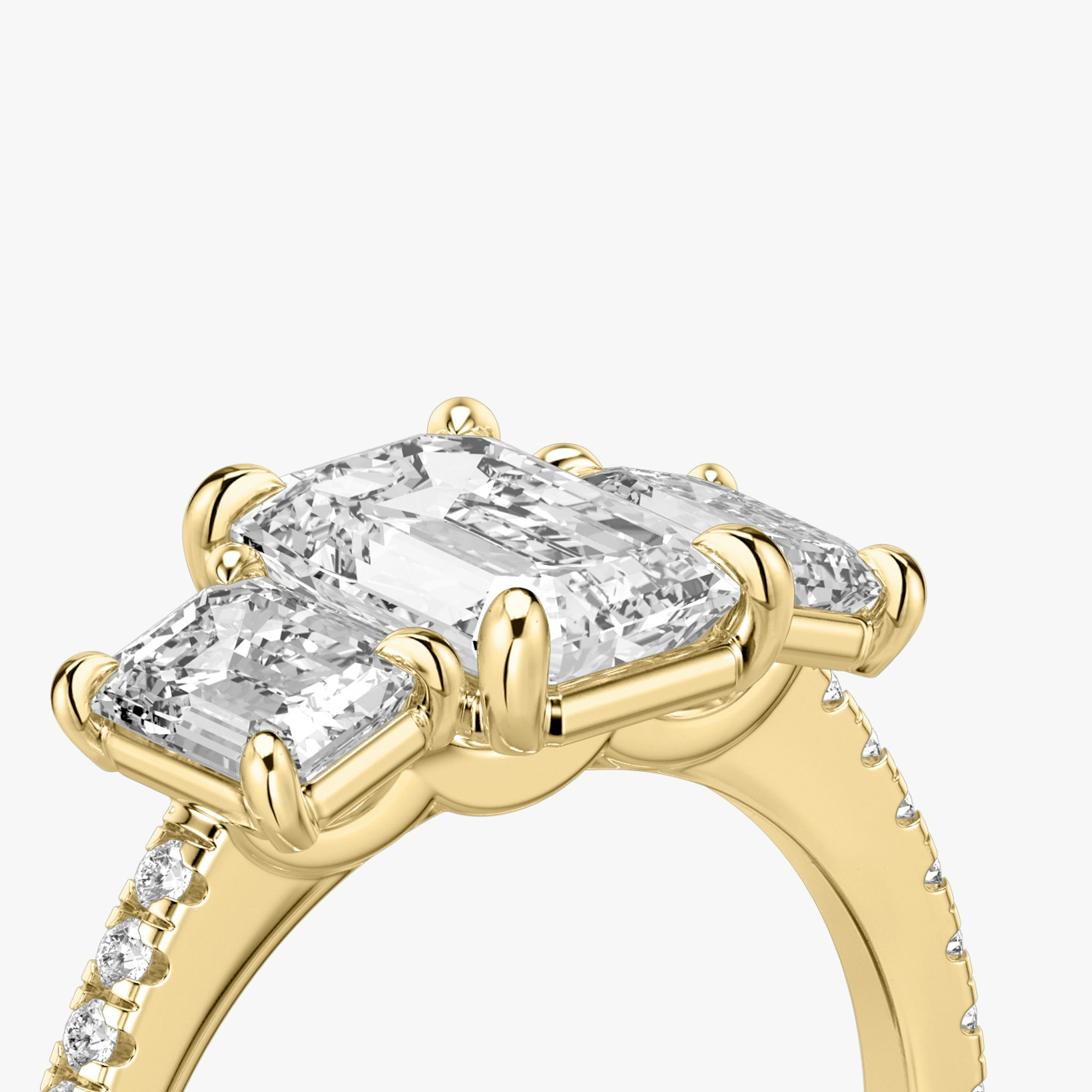 The Three Stone | Emerald | 18k | Yellow Gold | bandAccent: Pavé | sideStoneCarat: 0.50ct | sideStoneShape: Emerald | diamondOrientation: vertical | caratWeight: other