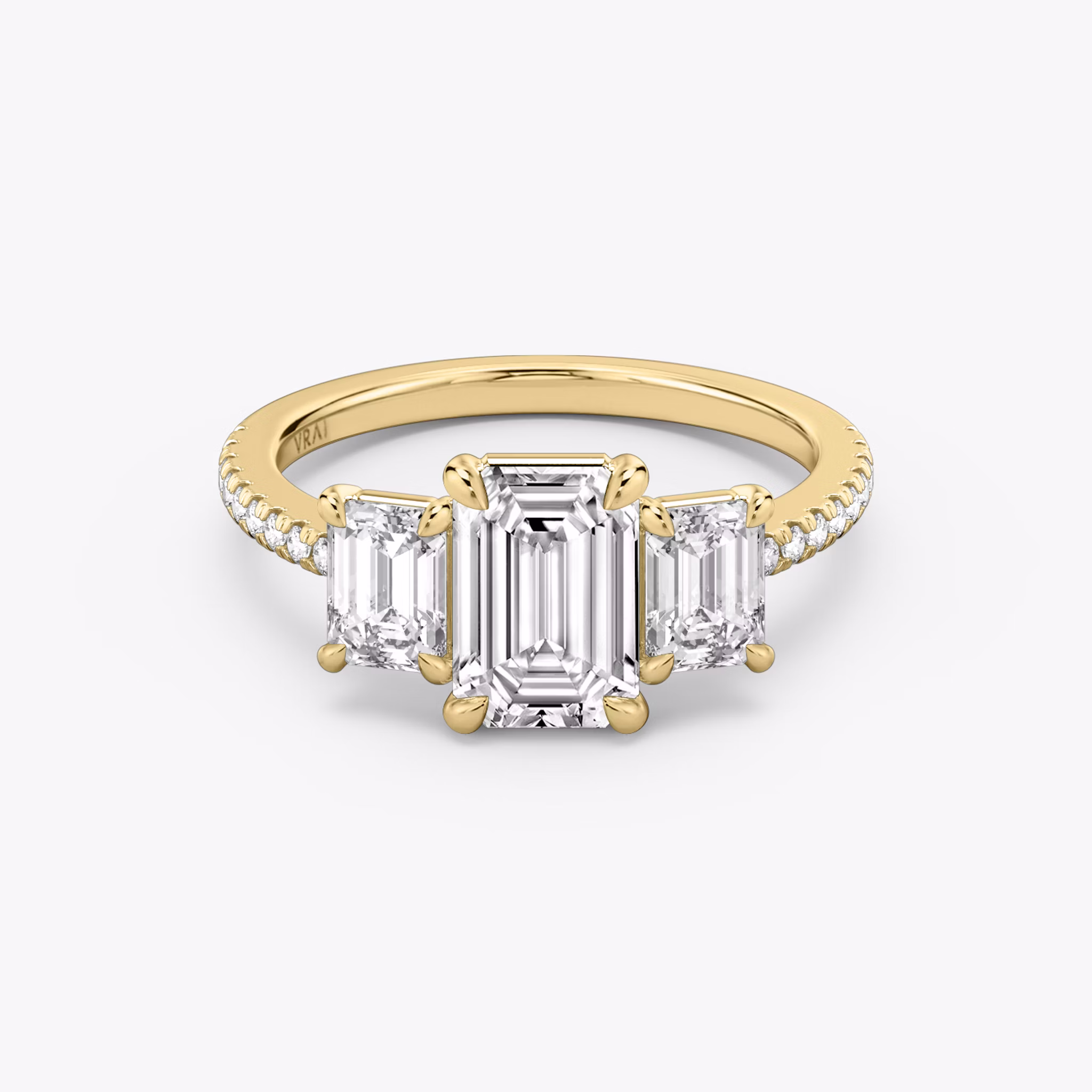 The Three Stone | Emerald | 18k | Yellow Gold | bandAccent: Pavé | sideStoneCarat: 0.50ct | sideStoneShape: Emerald | diamondOrientation: vertical | caratWeight: other