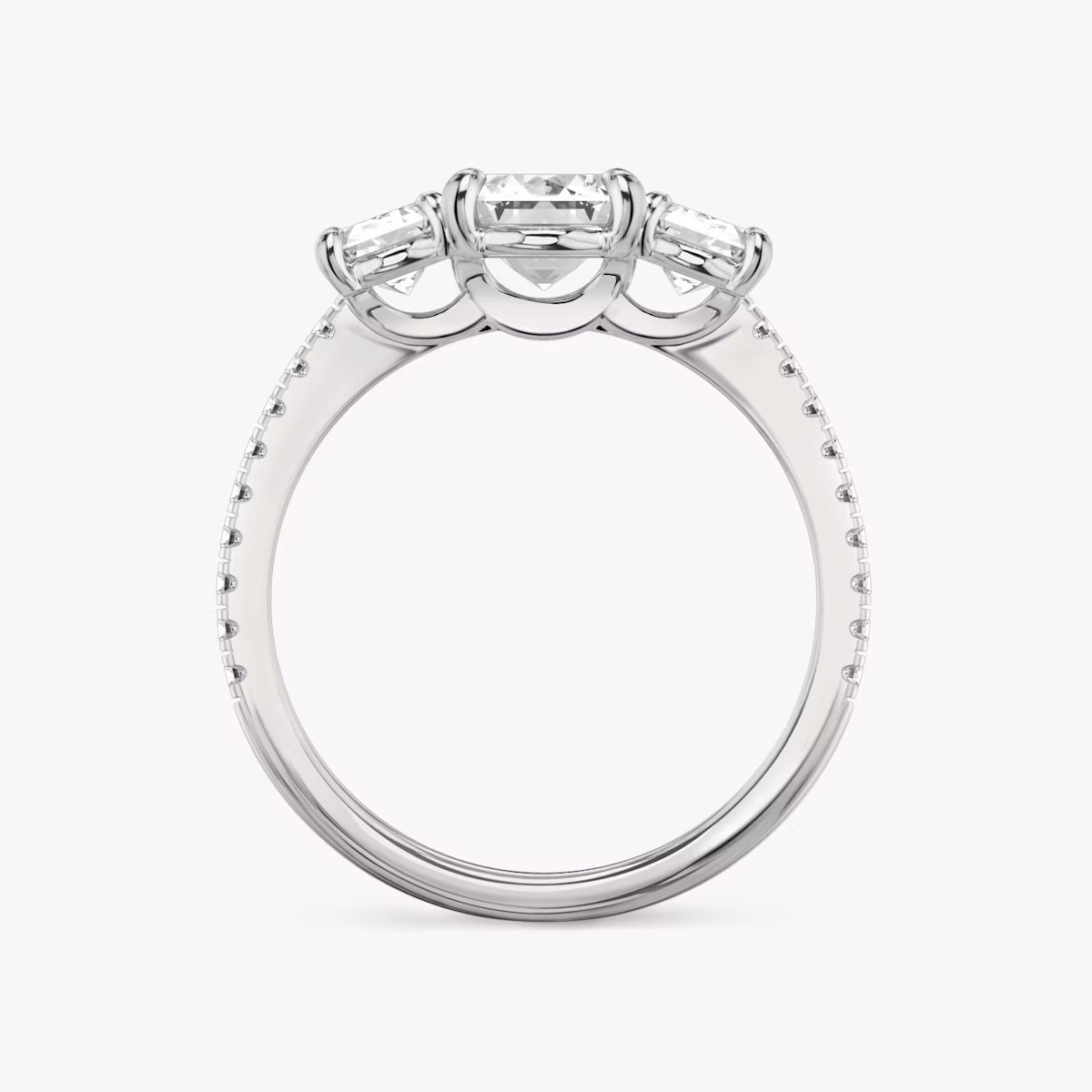 The Three Stone | Emerald | Platinum | bandAccent: Pavé | sideStoneCarat: 0.50ct | sideStoneShape: Emerald | diamondOrientation: vertical | caratWeight: other