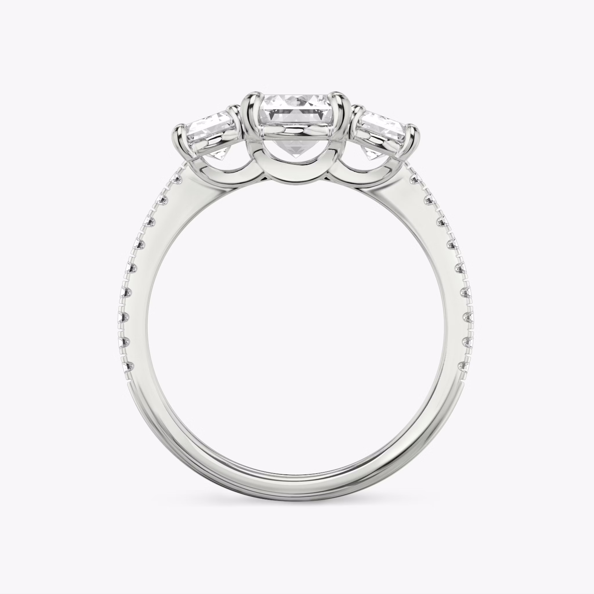 The Three Stone | Emerald | Platinum | bandAccent: Pavé | sideStoneCarat: 0.50ct | sideStoneShape: Emerald | diamondOrientation: vertical | caratWeight: other