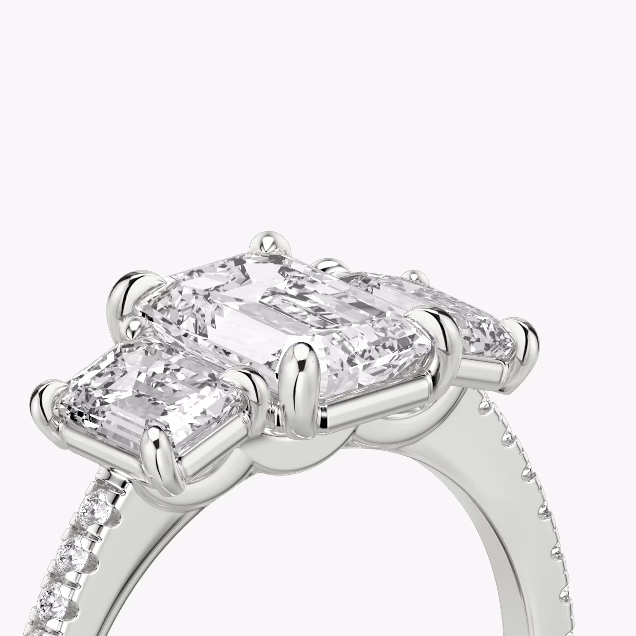 The Three Stone | Emerald | 18k | White Gold | bandAccent: Pavé | sideStoneCarat: 0.50ct | sideStoneShape: Emerald | diamondOrientation: vertical | caratWeight: other