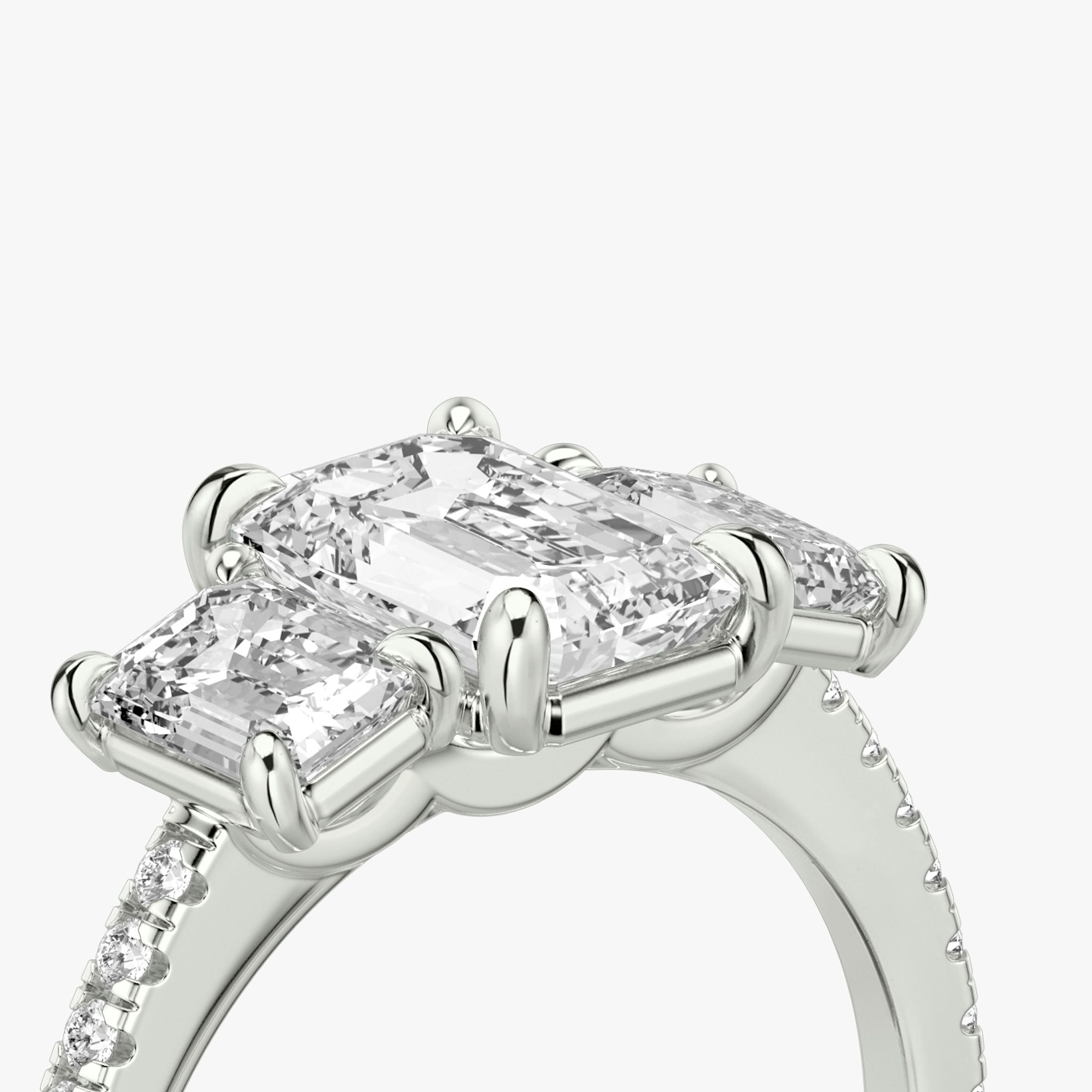 The Three Stone | Emerald | 18k | White Gold | bandAccent: Pavé | sideStoneCarat: 0.50ct | sideStoneShape: Emerald | diamondOrientation: vertical | caratWeight: other