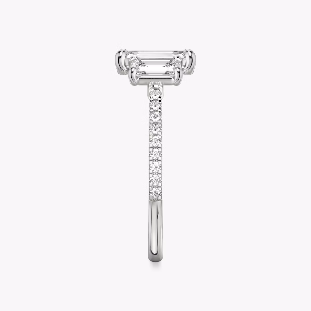 The Three Stone | Emerald | Platinum | bandAccent: Pavé | sideStoneCarat: 0.50ct | sideStoneShape: Emerald | diamondOrientation: vertical | caratWeight: other