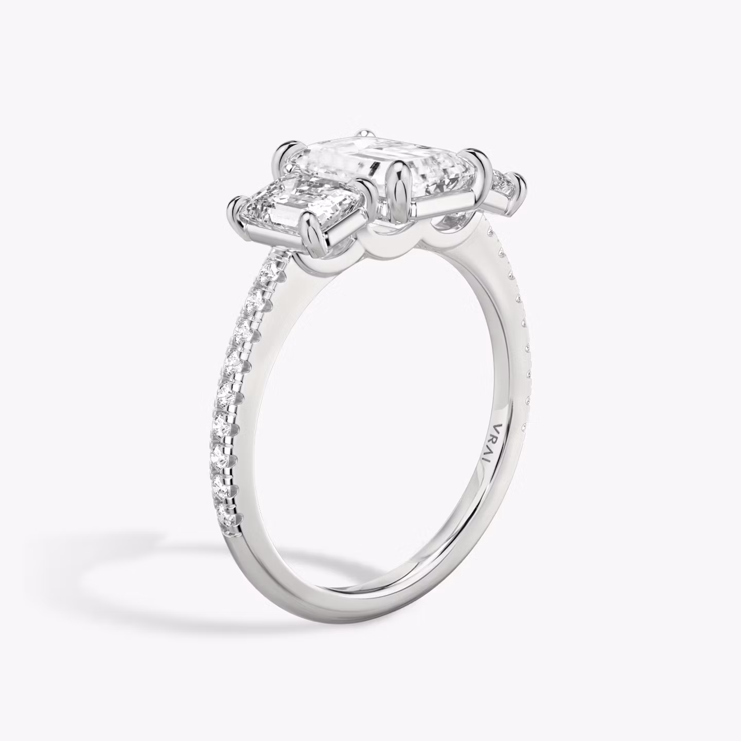 The Three Stone | Emerald | 18k | White Gold | bandAccent: Pavé | sideStoneCarat: 0.50ct | sideStoneShape: Emerald | diamondOrientation: vertical | caratWeight: other