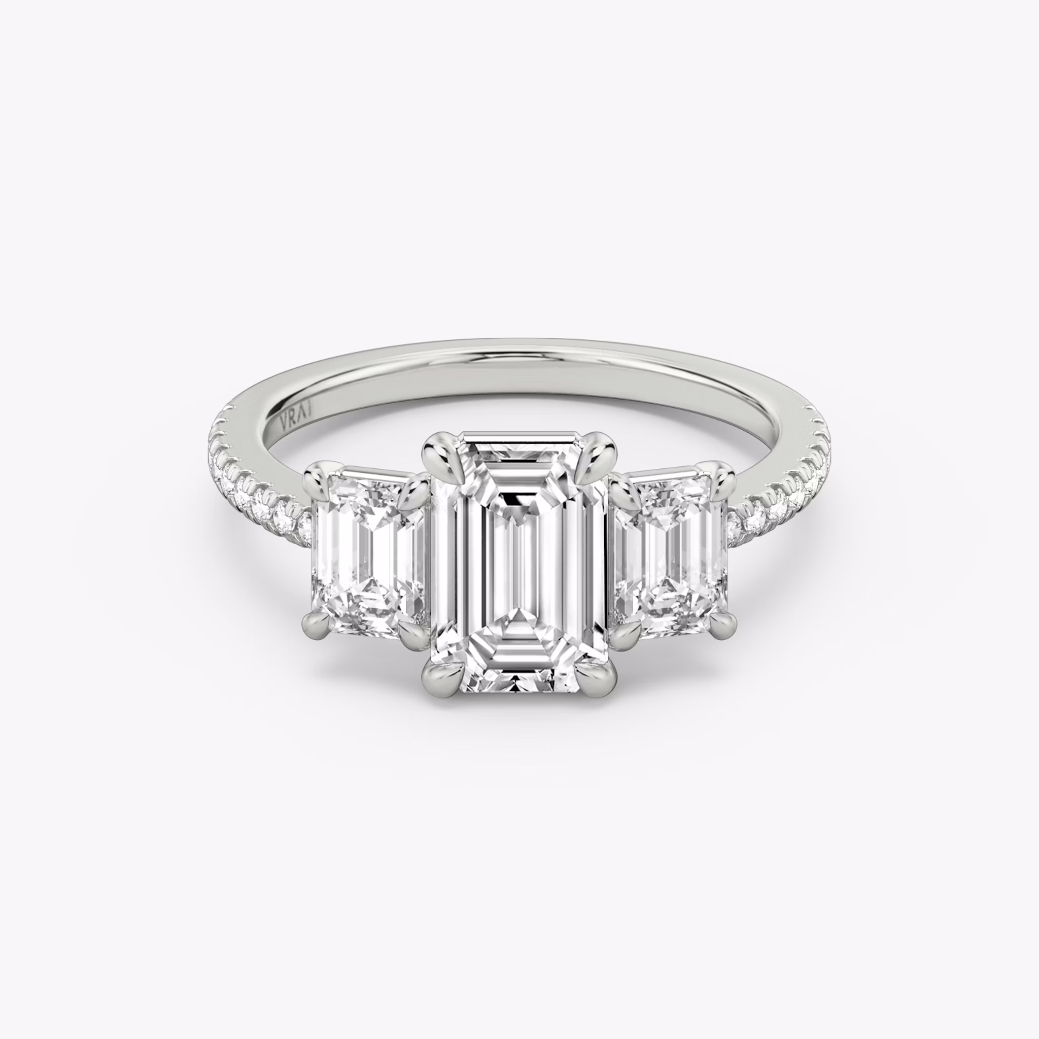 The Three Stone | Emerald | 18k | White Gold | bandAccent: Pavé | sideStoneCarat: 0.50ct | sideStoneShape: Emerald | diamondOrientation: vertical | caratWeight: other
