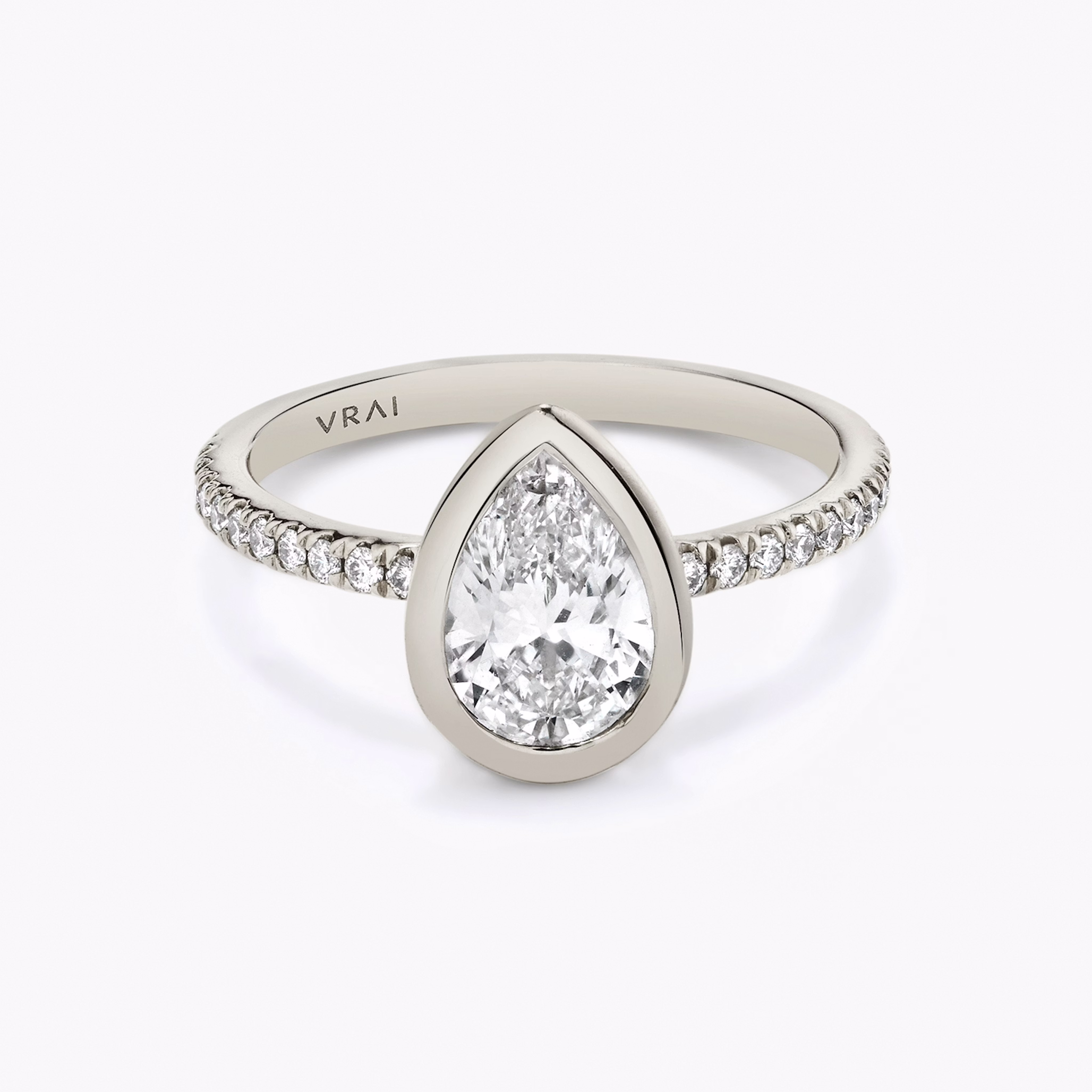 Platinum Signature Bezel engagement ring with Pear cut diamond