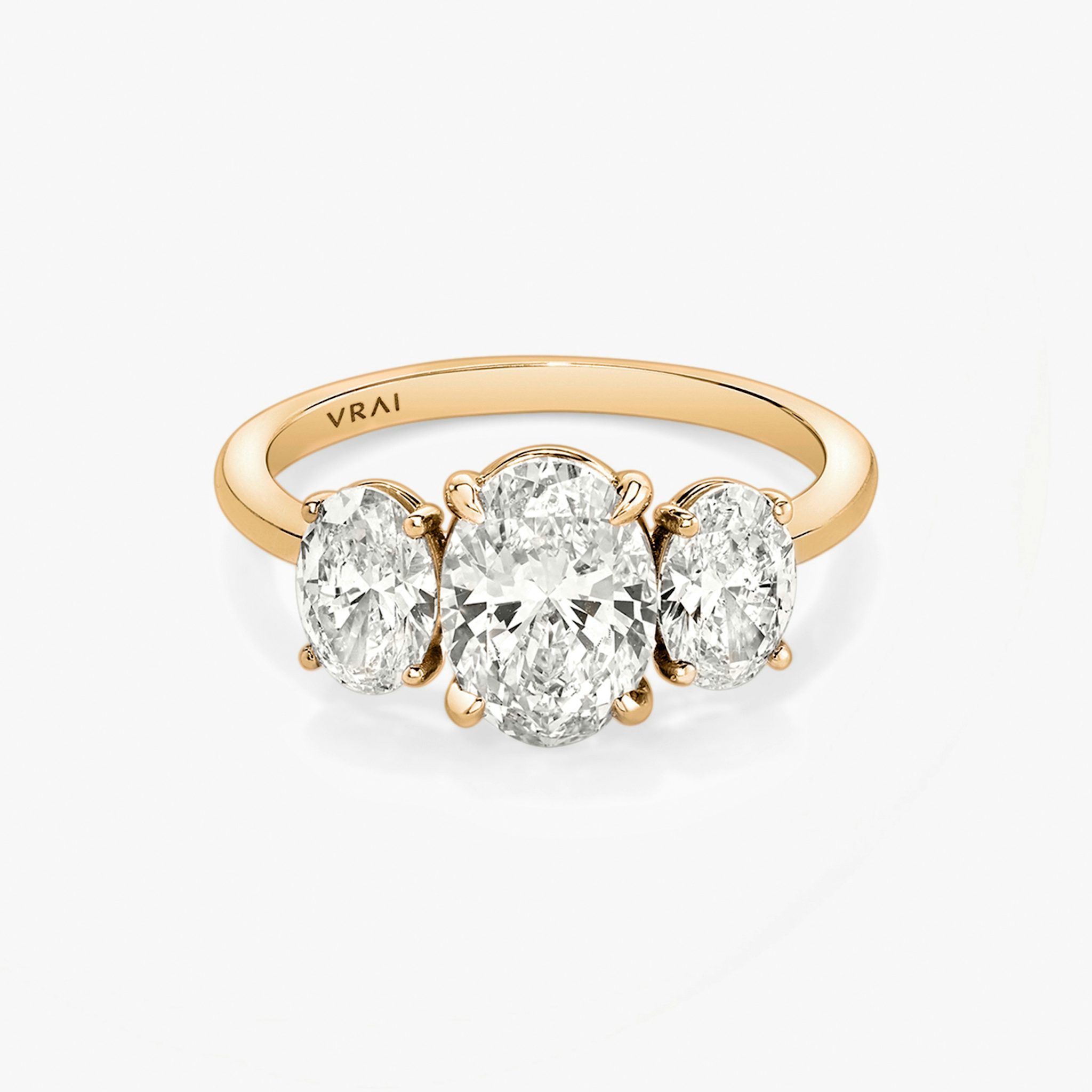 The Three Stone | Oval | 14k | Rose Gold | bandAccent: Plain | sideStoneCarat: 0.50ct | sideStoneShape: Oval | diamondOrientation: vertical | caratWeight: other