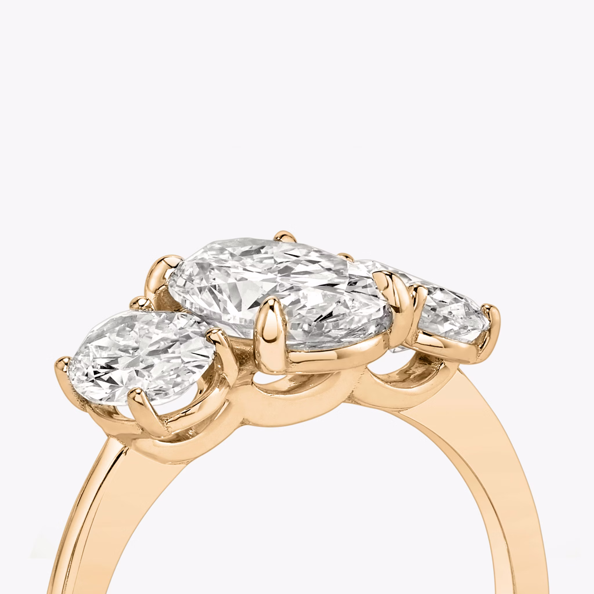 The Three Stone | Oval | 14k | Rose Gold | bandAccent: Plain | sideStoneCarat: 0.50ct | sideStoneShape: Oval | diamondOrientation: vertical | caratWeight: other