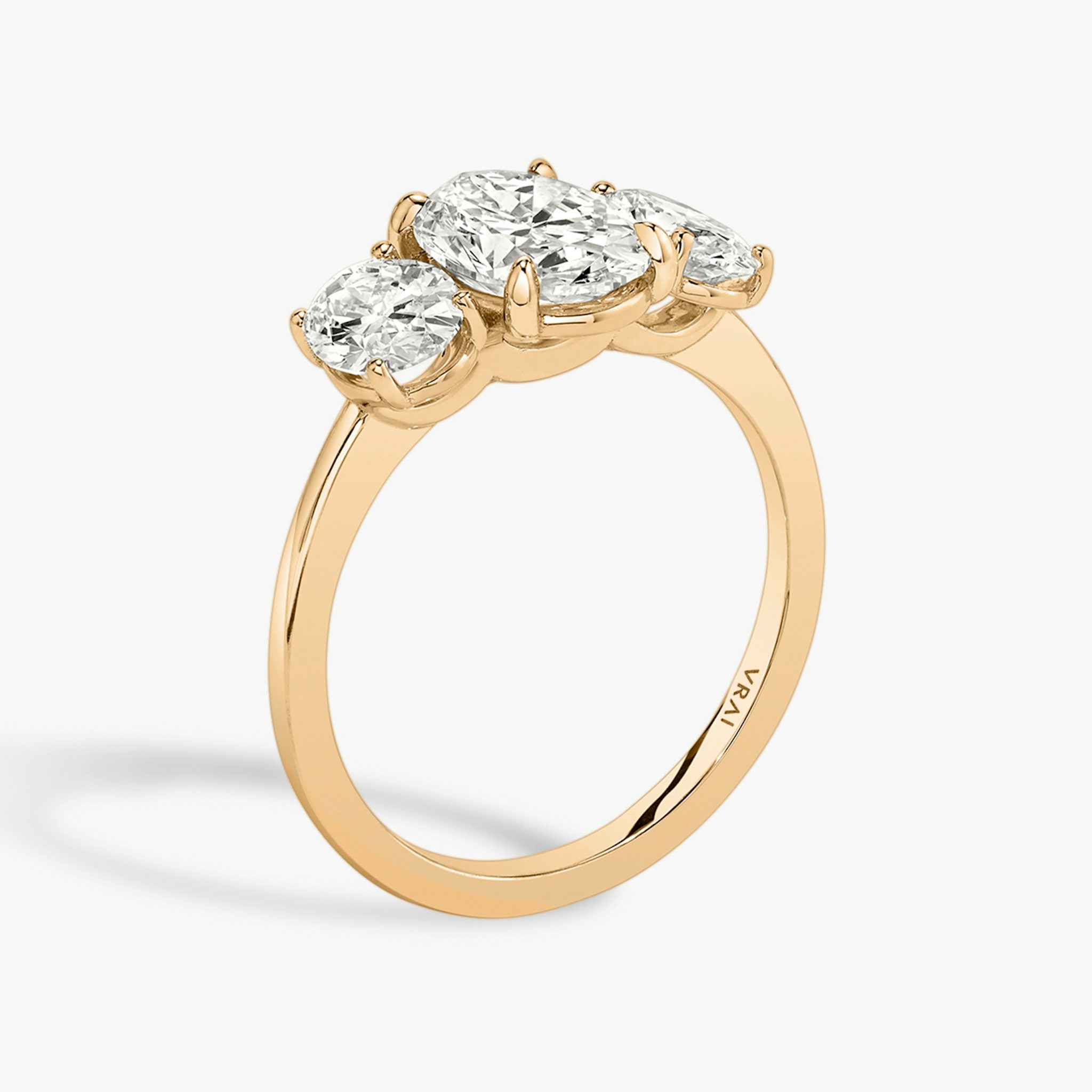 The Three Stone | Oval | 14k | Rose Gold | bandAccent: Plain | sideStoneCarat: 0.50ct | sideStoneShape: Oval | diamondOrientation: vertical | caratWeight: other