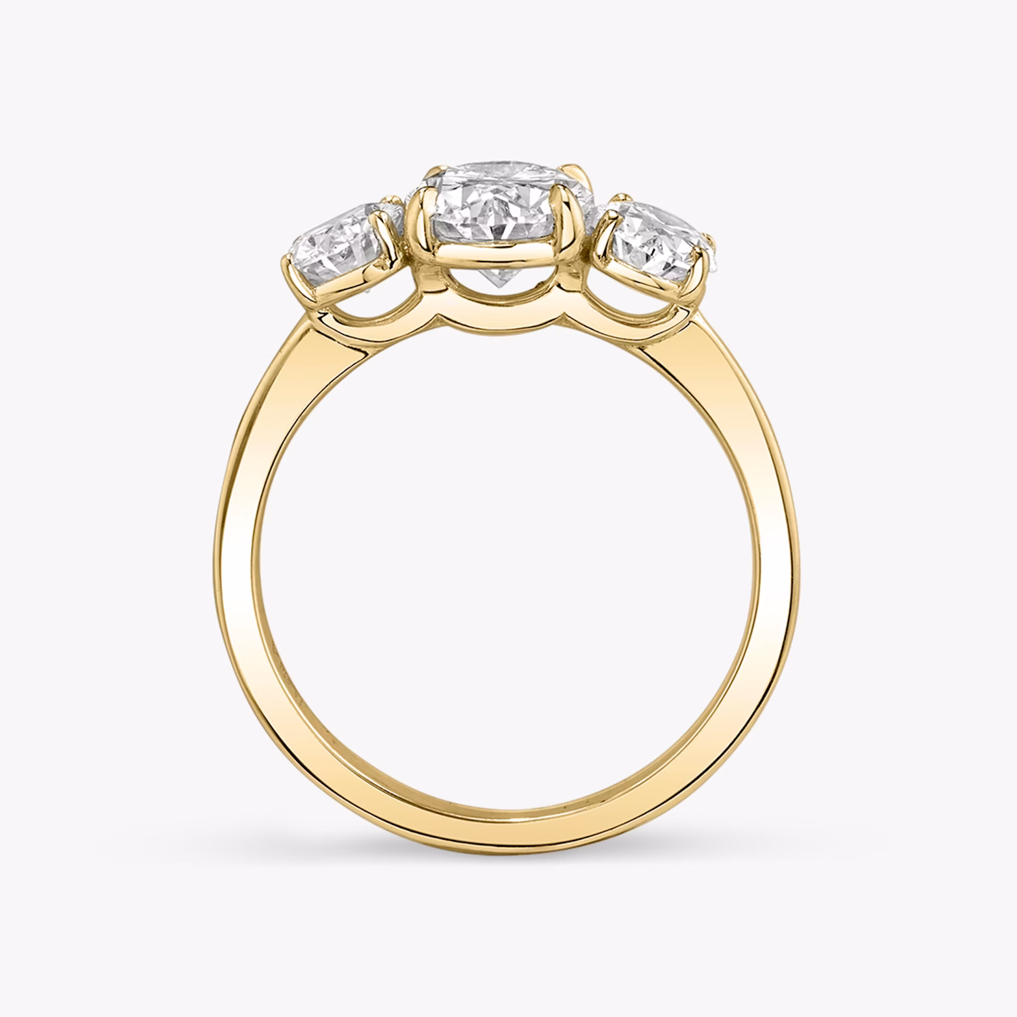 The Three Stone | Oval | 18k | Yellow Gold | bandAccent: Plain | sideStoneCarat: 0.50ct | sideStoneShape: Oval | diamondOrientation: vertical | caratWeight: other