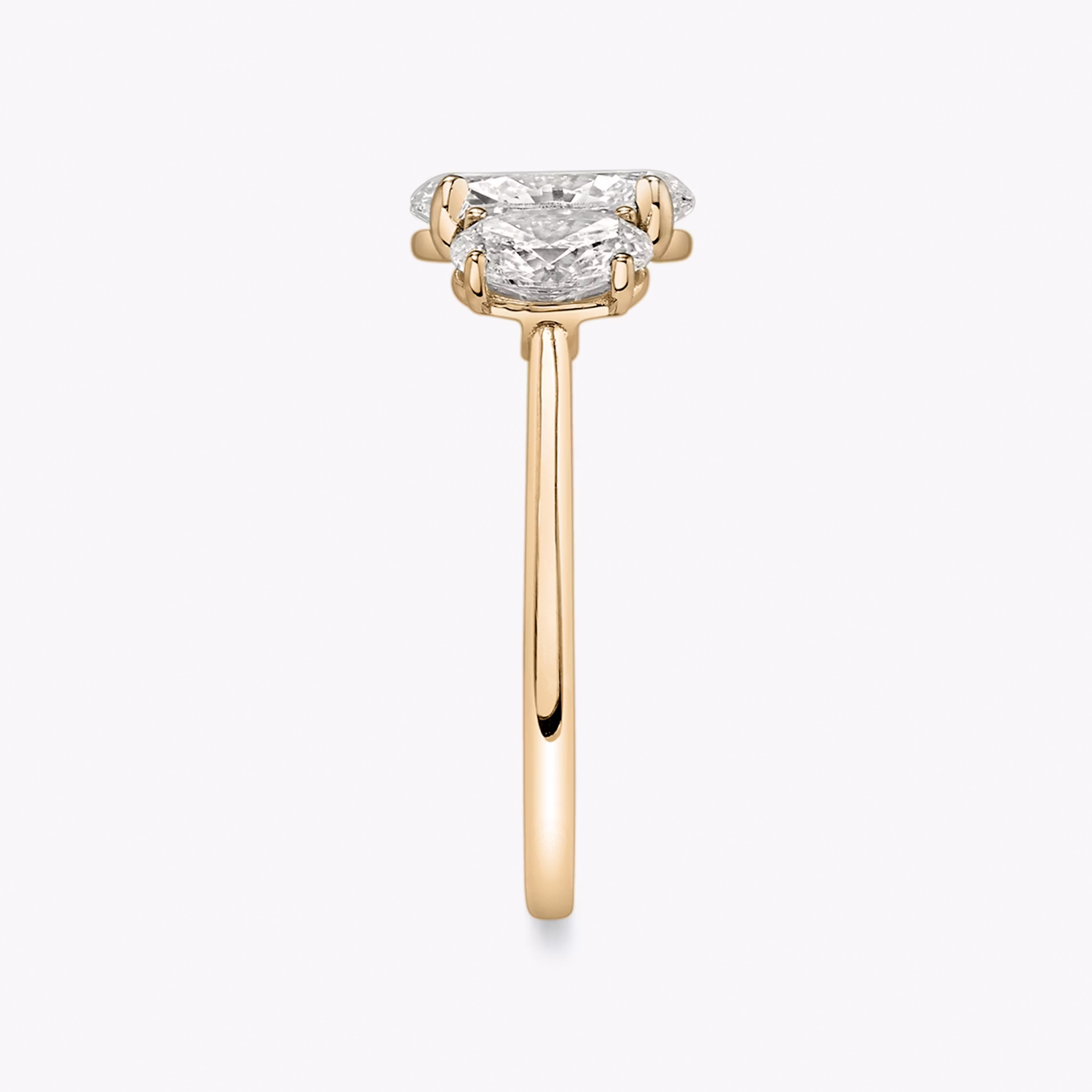 The Three Stone | Oval | 14k | Rose Gold | bandAccent: Plain | sideStoneCarat: 0.50ct | sideStoneShape: Oval | diamondOrientation: vertical | caratWeight: other