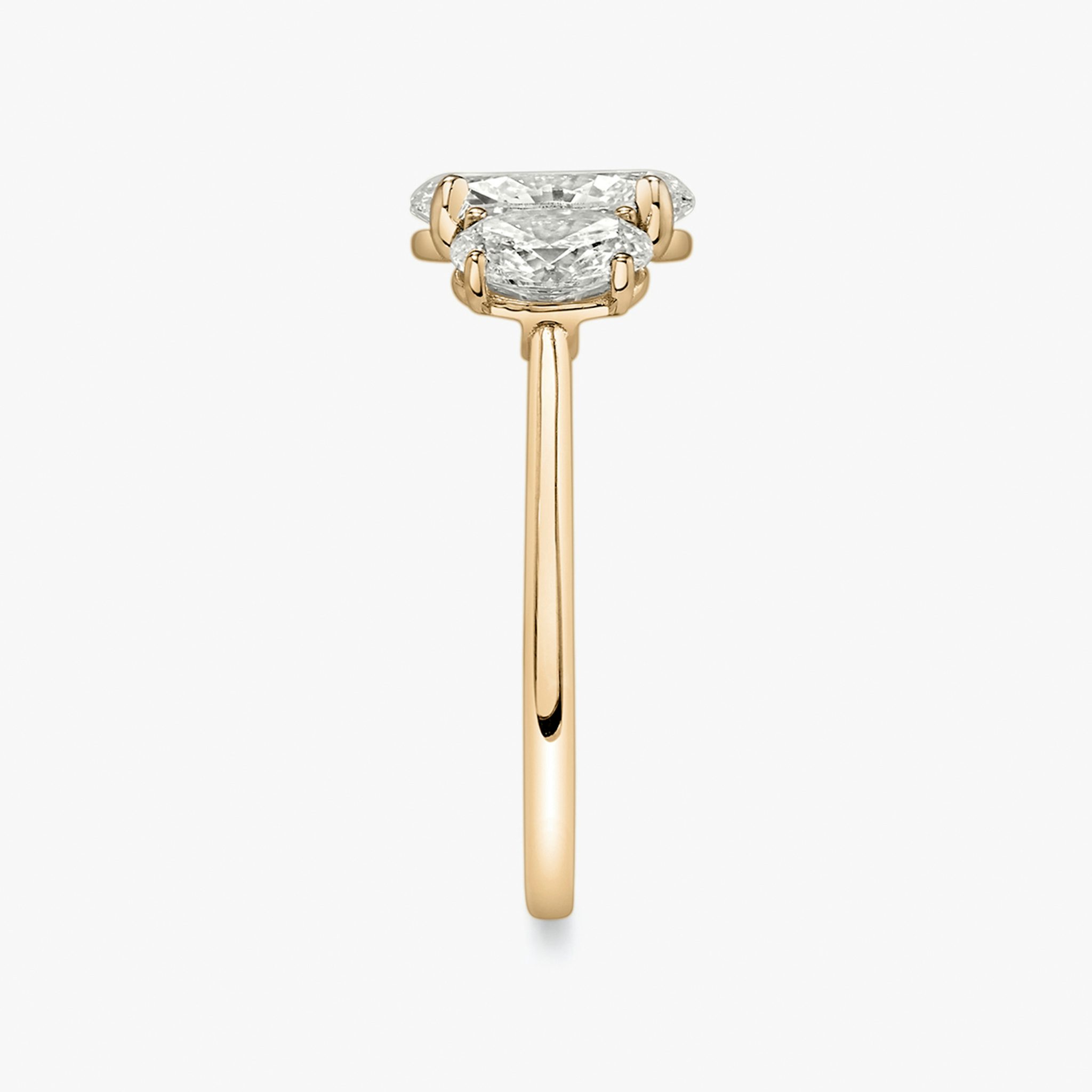 The Three Stone | Oval | 14k | Rose Gold | bandAccent: Plain | sideStoneCarat: 0.50ct | sideStoneShape: Oval | diamondOrientation: vertical | caratWeight: other
