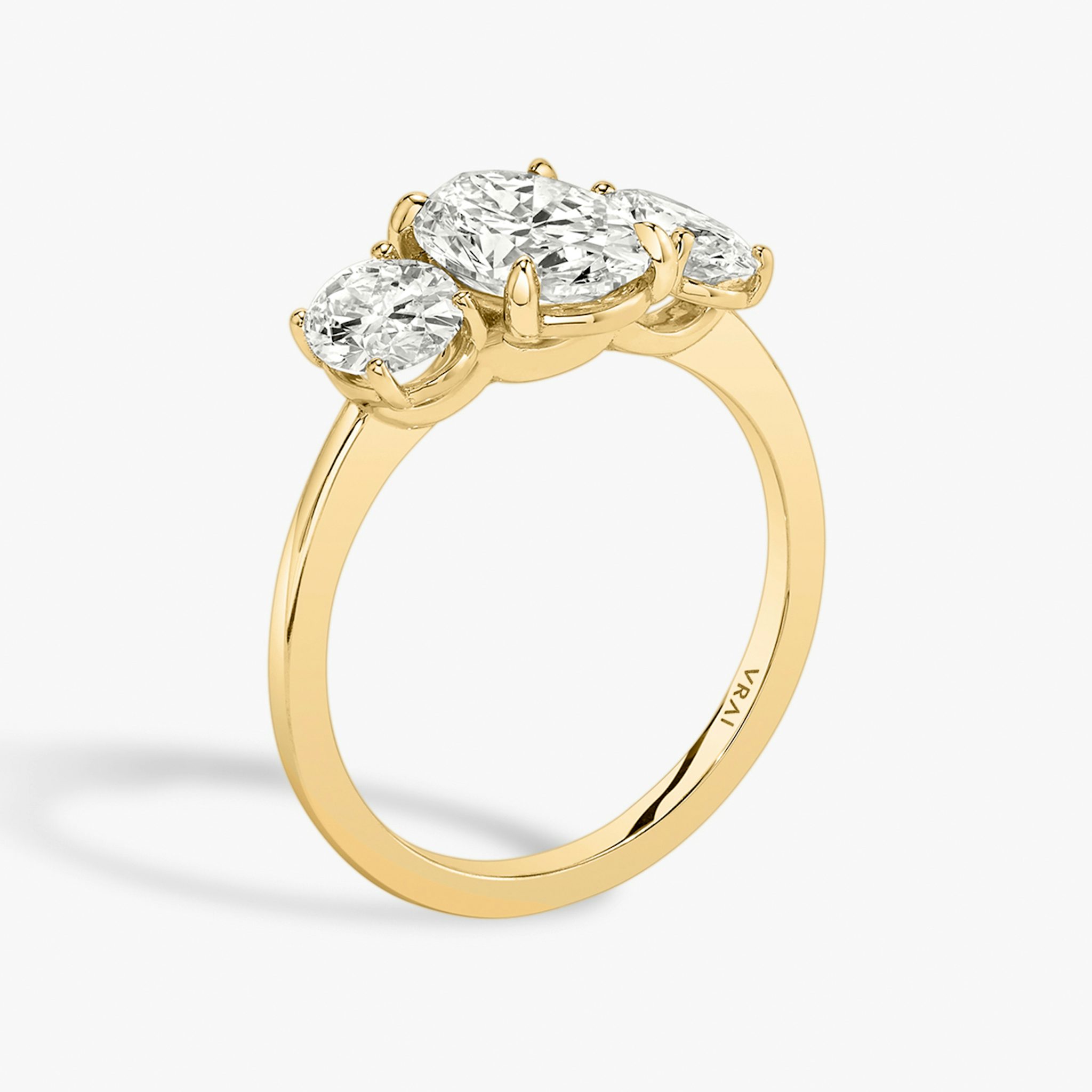 The Three Stone | Oval | 18k | Yellow Gold | bandAccent: Plain | sideStoneCarat: 0.50ct | sideStoneShape: Oval | diamondOrientation: vertical | caratWeight: other