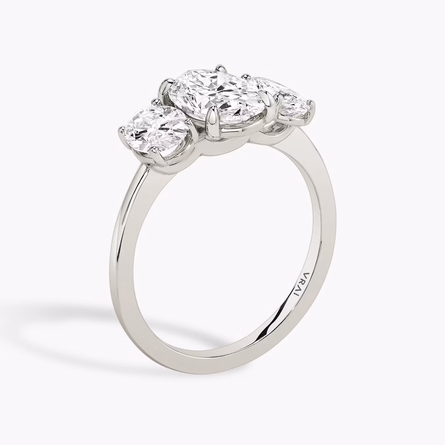 The Three Stone | Oval | Platinum | bandAccent: Plain | sideStoneCarat: 0.50ct | sideStoneShape: Oval | diamondOrientation: vertical | caratWeight: other