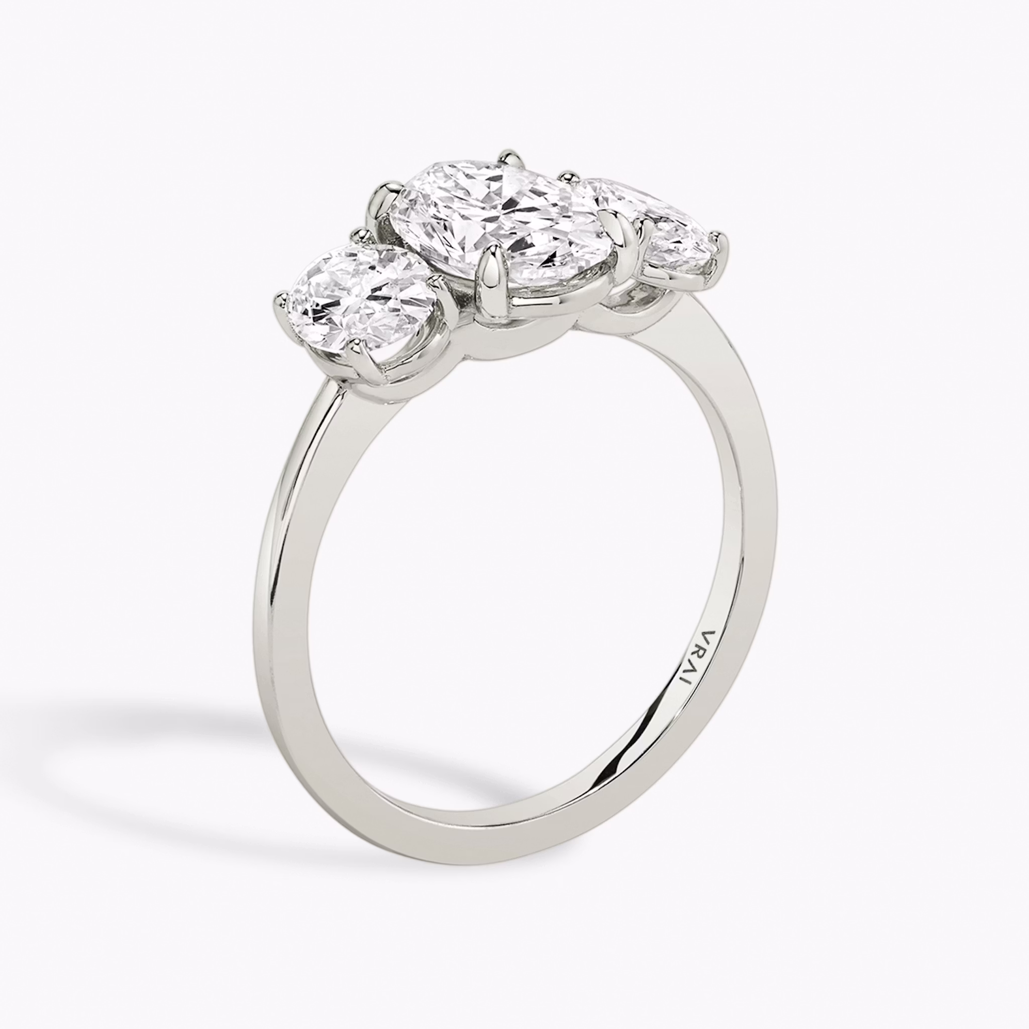 The Three Stone | Oval | 18k | White Gold | bandAccent: Plain | sideStoneCarat: 0.50ct | sideStoneShape: Oval | diamondOrientation: vertical | caratWeight: other