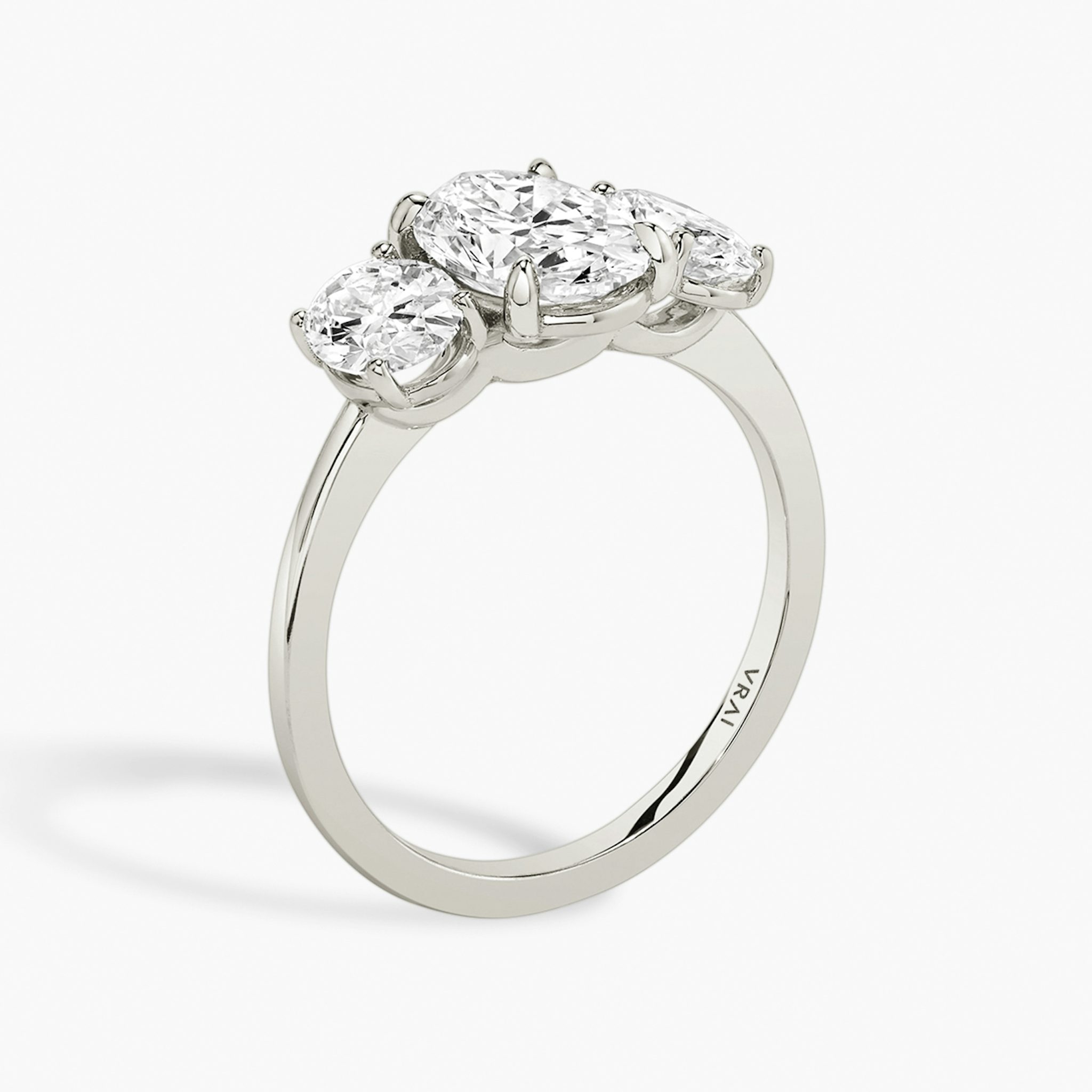 The Three Stone | Oval | 18k | White Gold | bandAccent: Plain | sideStoneCarat: 0.50ct | sideStoneShape: Oval | diamondOrientation: vertical | caratWeight: other