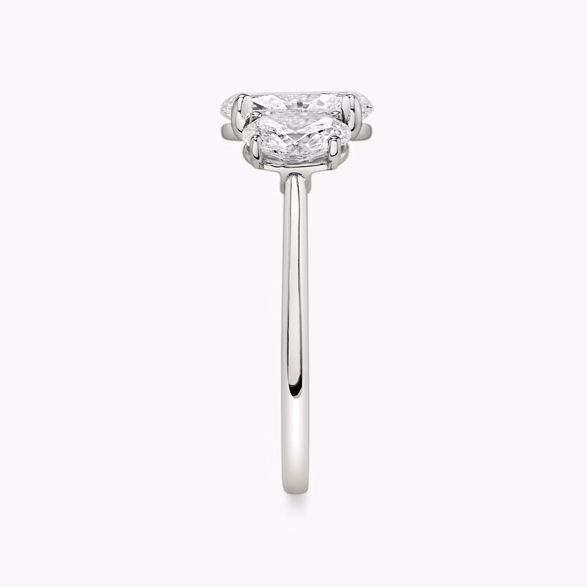 The Three Stone | Oval | Platinum | bandAccent: Plain | sideStoneCarat: 0.50ct | sideStoneShape: Oval | diamondOrientation: vertical | caratWeight: other