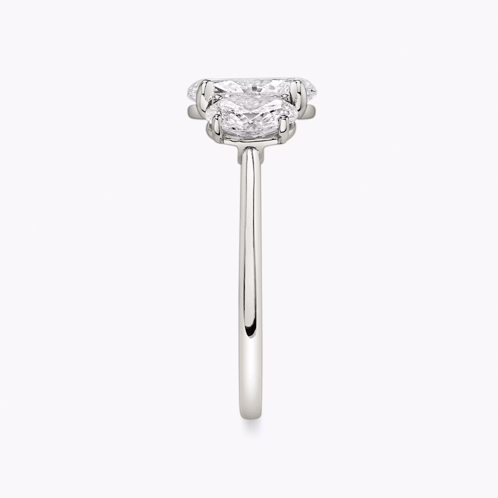 The Three Stone | Oval | Platinum | bandAccent: Plain | sideStoneCarat: 0.50ct | sideStoneShape: Oval | diamondOrientation: vertical | caratWeight: other