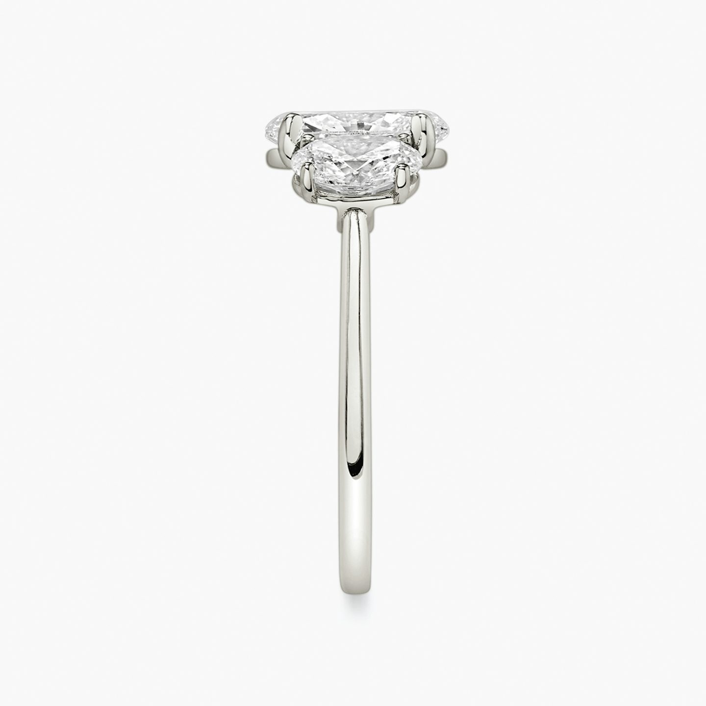 The Three Stone | Oval | Platinum | bandAccent: Plain | sideStoneCarat: 0.50ct | sideStoneShape: Oval | diamondOrientation: vertical | caratWeight: other