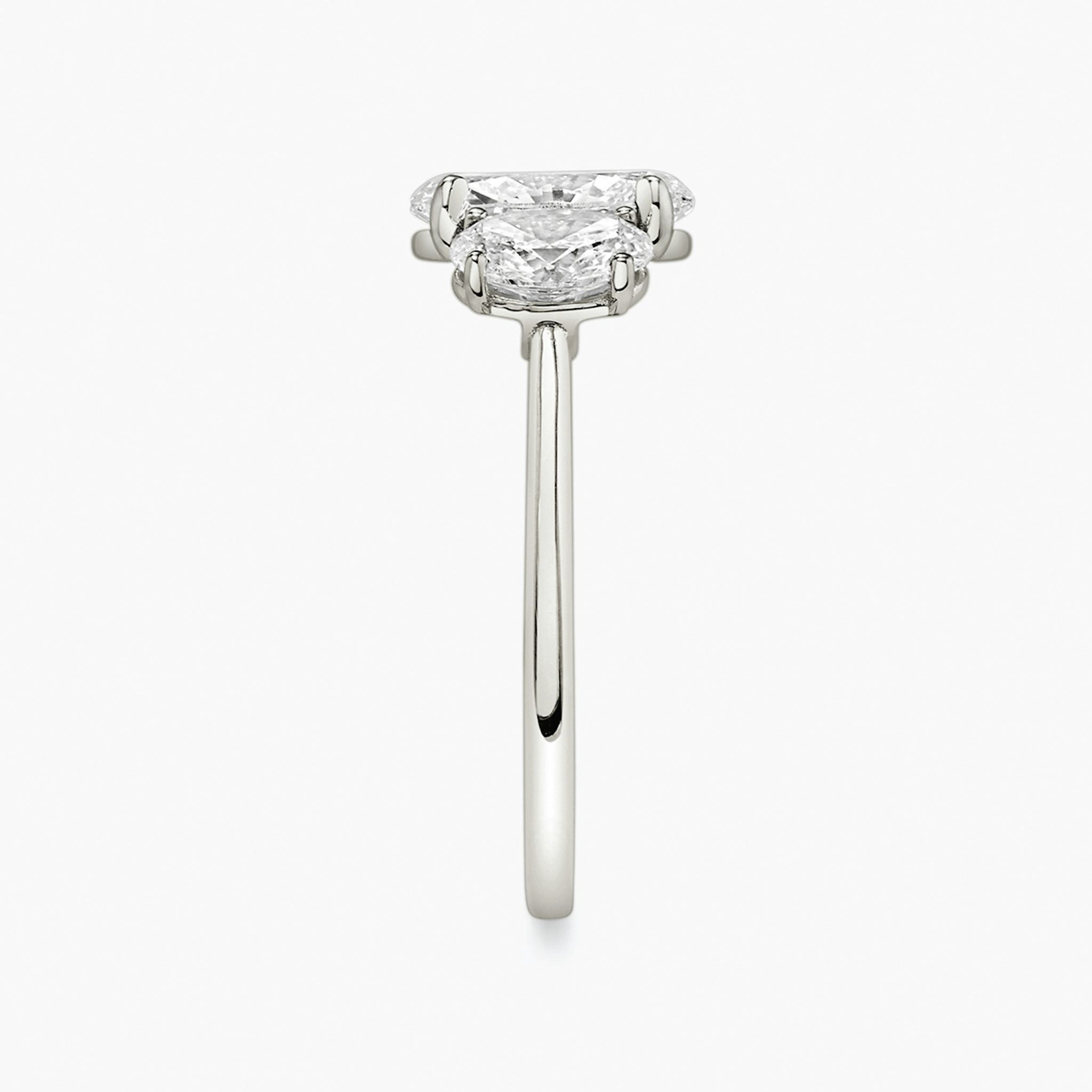 The Three Stone | Oval | Platinum | bandAccent: Plain | sideStoneCarat: 0.50ct | sideStoneShape: Oval | diamondOrientation: vertical | caratWeight: other
