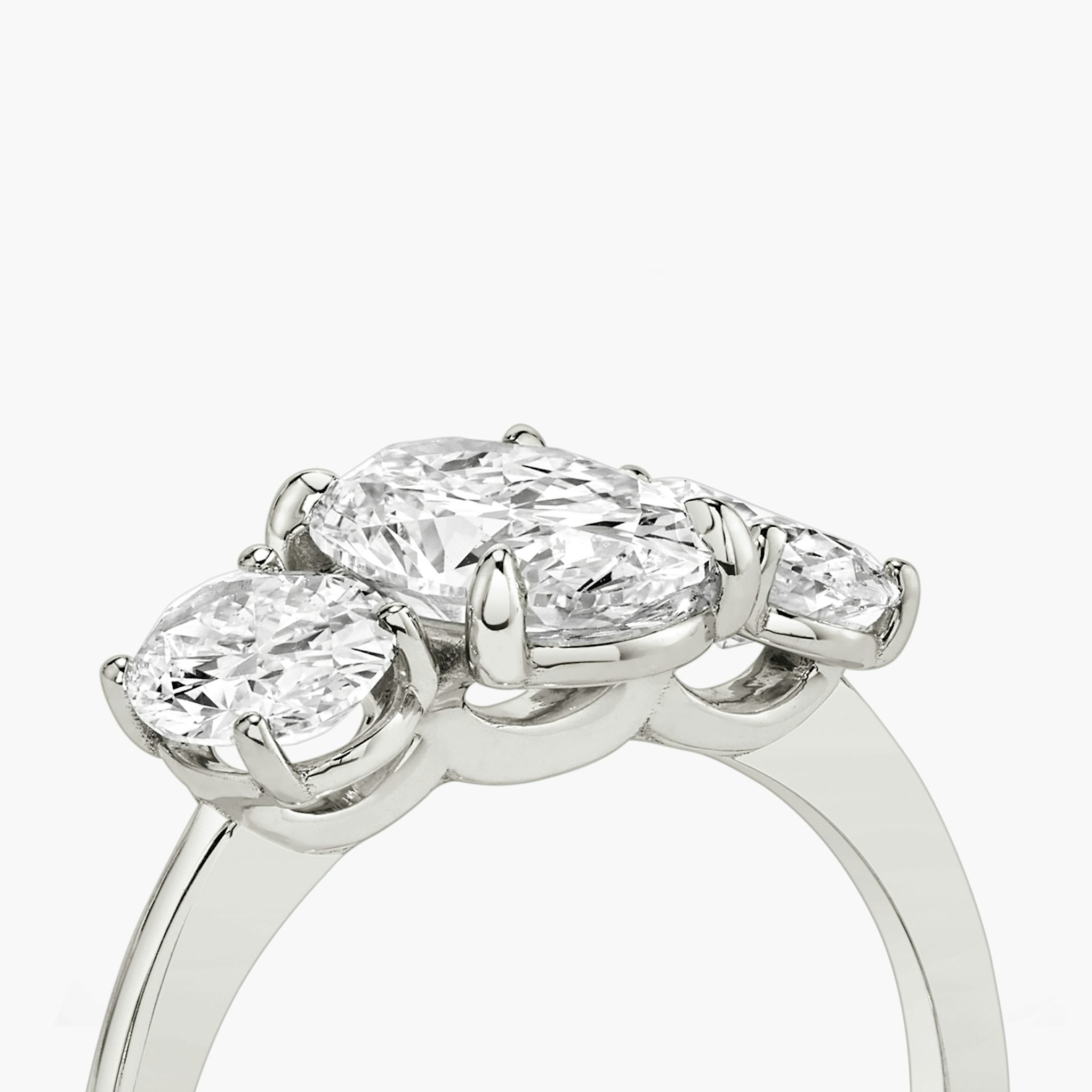 The Three Stone | Oval | Platinum | bandAccent: Plain | sideStoneCarat: 0.50ct | sideStoneShape: Oval | diamondOrientation: vertical | caratWeight: other