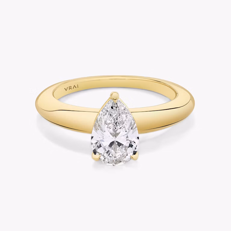 Front view of the curator pear yellow gold engagement ring