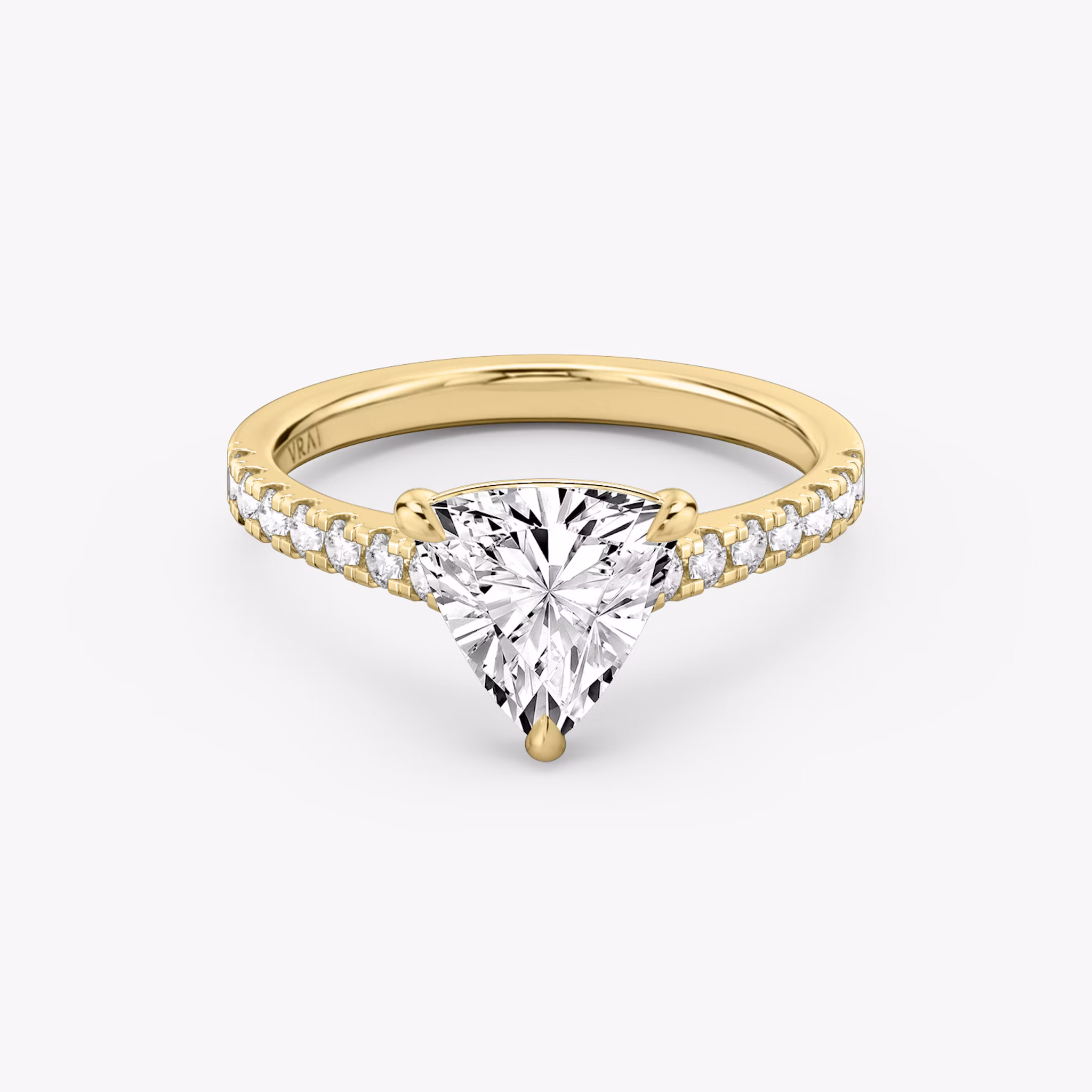Cathedral engagement ring with trillion cut diamond and pavé band