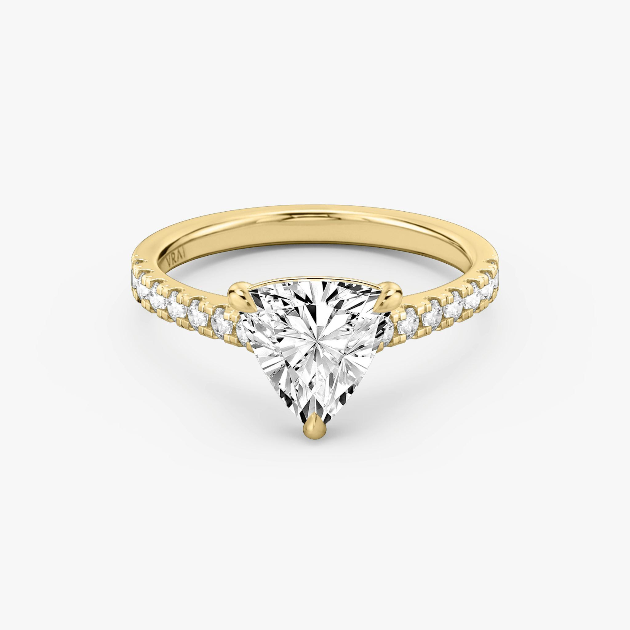 Cathedral engagement ring with trillion cut diamond and pavé band