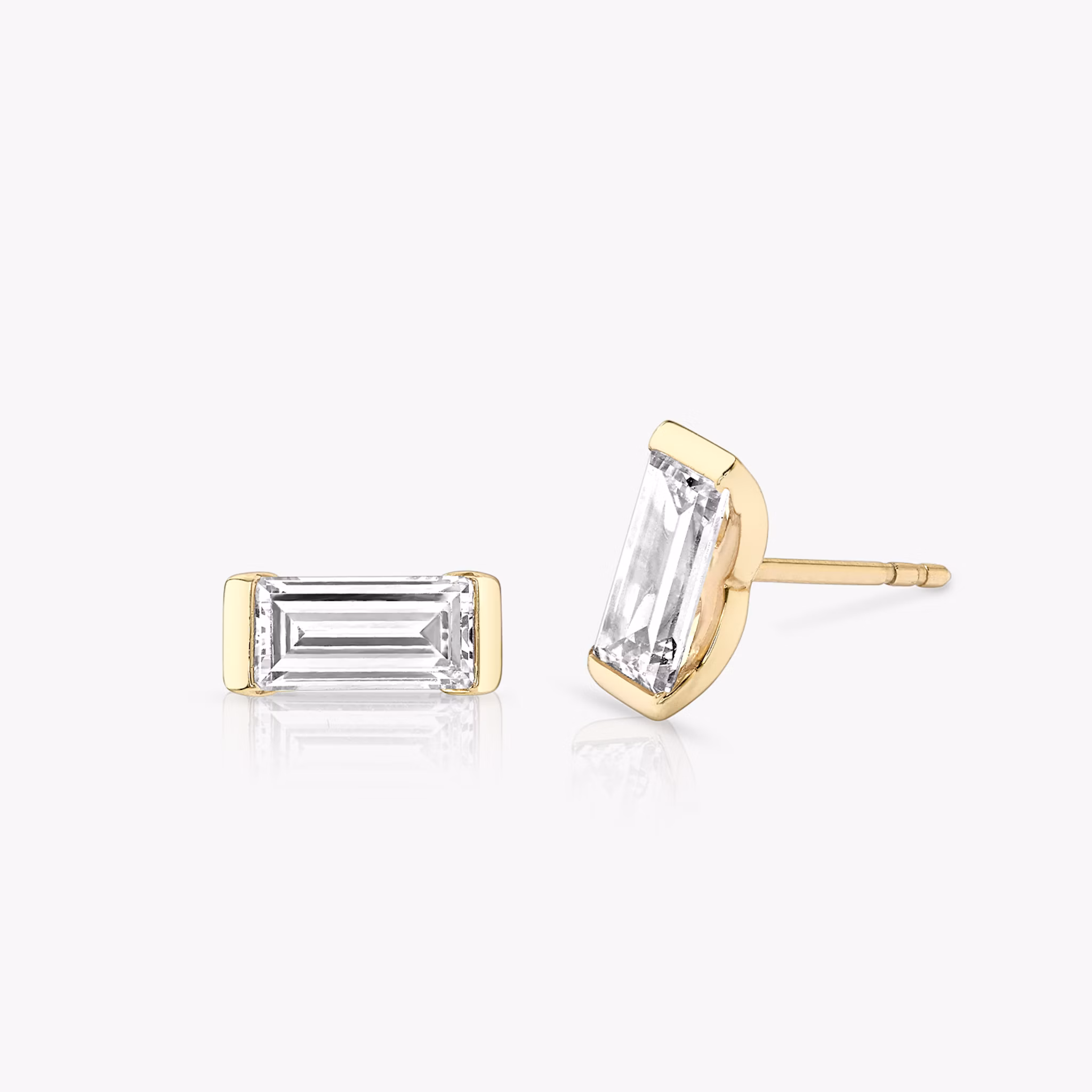 A pair of Knife-Edge Baguette Semi-Bezel Studs.