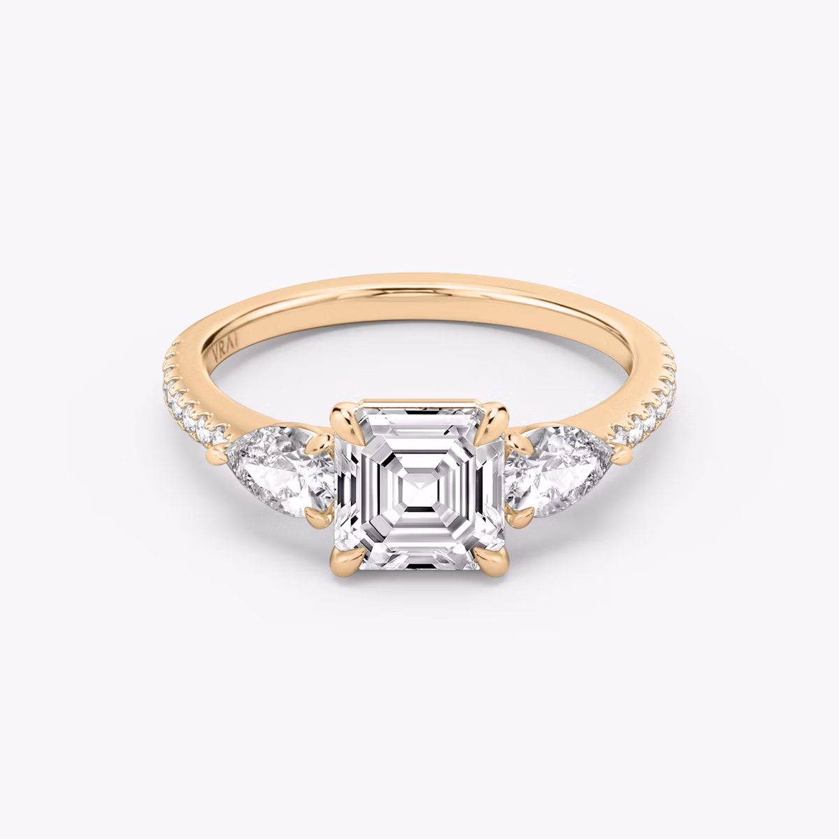 The Three Stone | Asscher | 14k | Rose Gold | bandAccent: Pavé | sideStoneCarat: 0.25ct | sideStoneShape: Pear | diamondOrientation: vertical | caratWeight: other