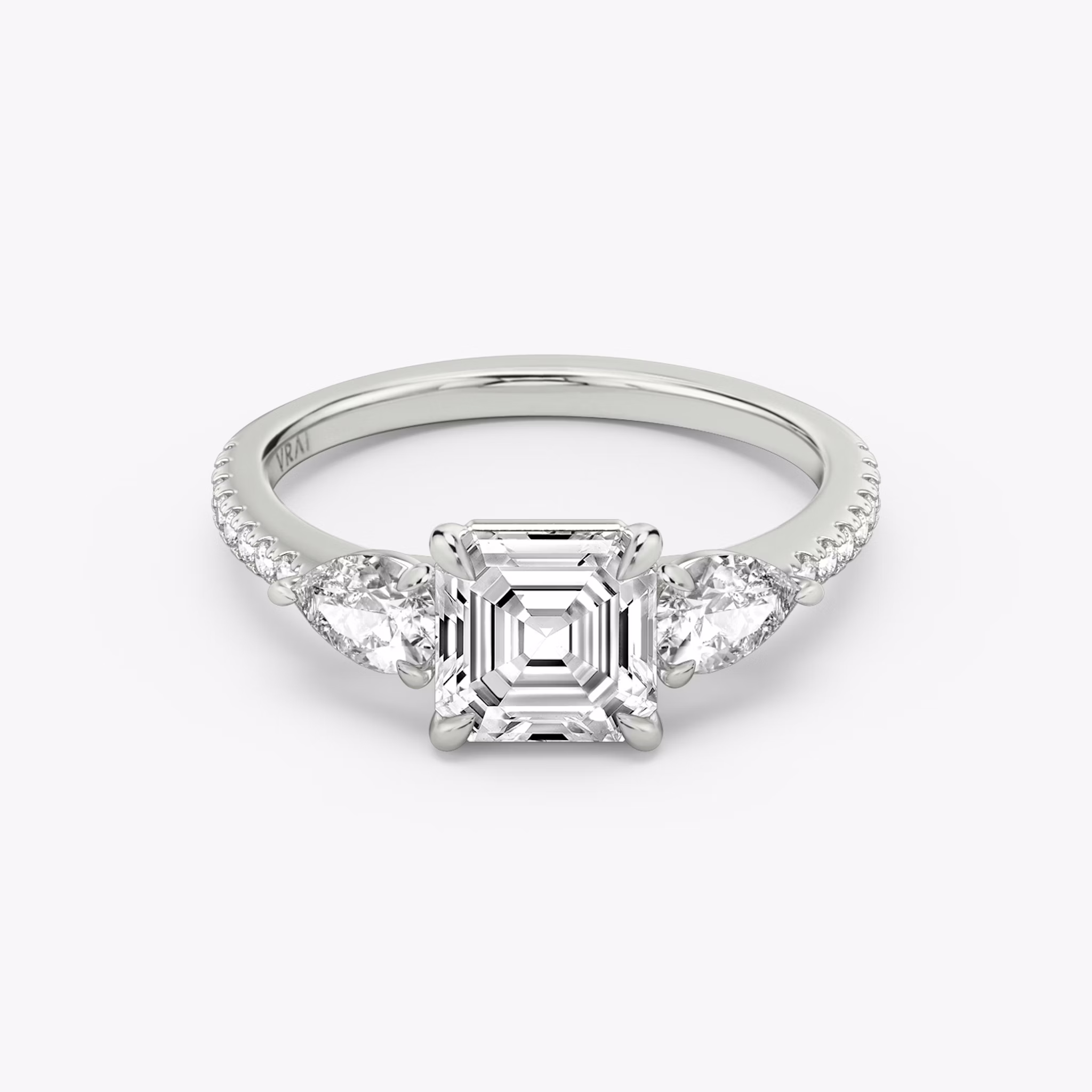 The Three Stone | Asscher | Platinum | bandAccent: Pavé | sideStoneCarat: 0.25ct | sideStoneShape: Pear | diamondOrientation: vertical | caratWeight: other
