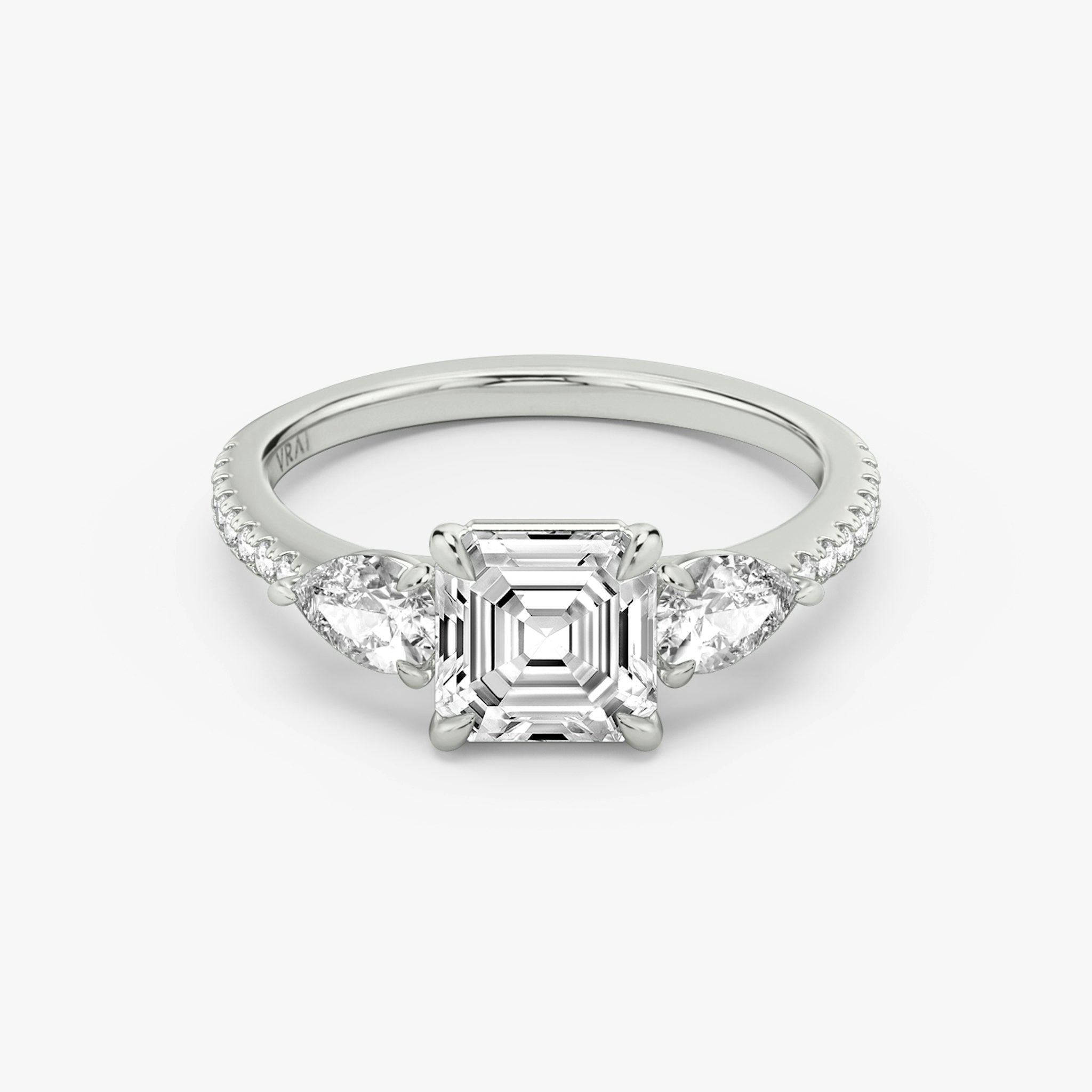 The Three Stone | Asscher | Platinum | bandAccent: Pavé | sideStoneCarat: 0.25ct | sideStoneShape: Pear | diamondOrientation: vertical | caratWeight: other