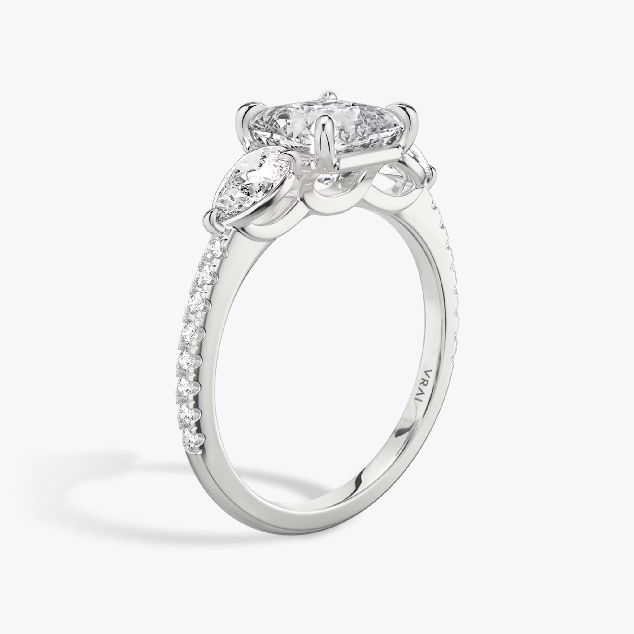 The Three Stone | Asscher | Platinum | bandAccent: Pavé | sideStoneCarat: 0.25ct | sideStoneShape: Pear | diamondOrientation: vertical | caratWeight: other