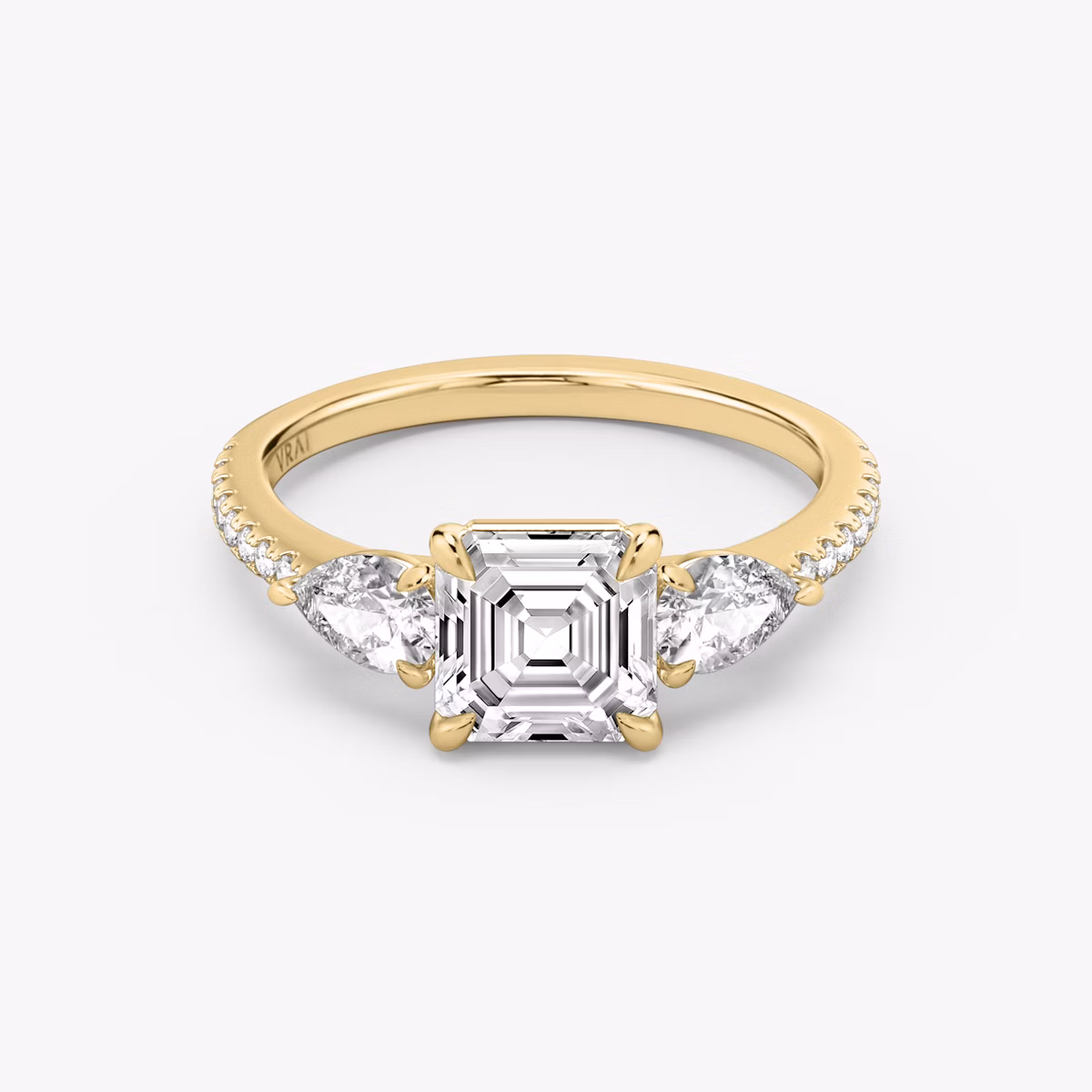 The Three Stone | Asscher | 18k | Yellow Gold | bandAccent: Pavé | sideStoneCarat: 0.25ct | sideStoneShape: Pear | diamondOrientation: vertical | caratWeight: other