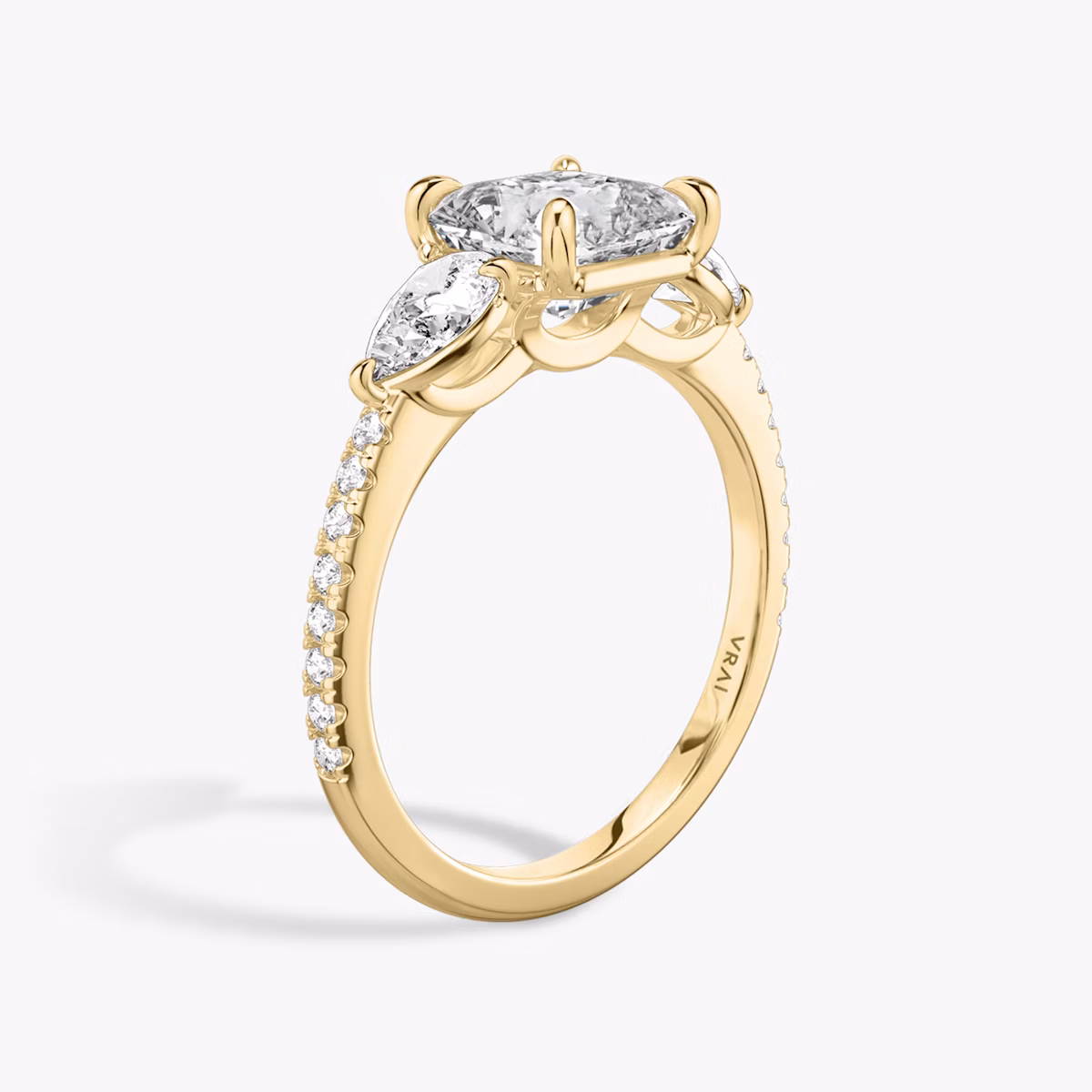 The Three Stone | Asscher | 18k | Yellow Gold | bandAccent: Pavé | sideStoneCarat: 0.25ct | sideStoneShape: Pear | diamondOrientation: vertical | caratWeight: other