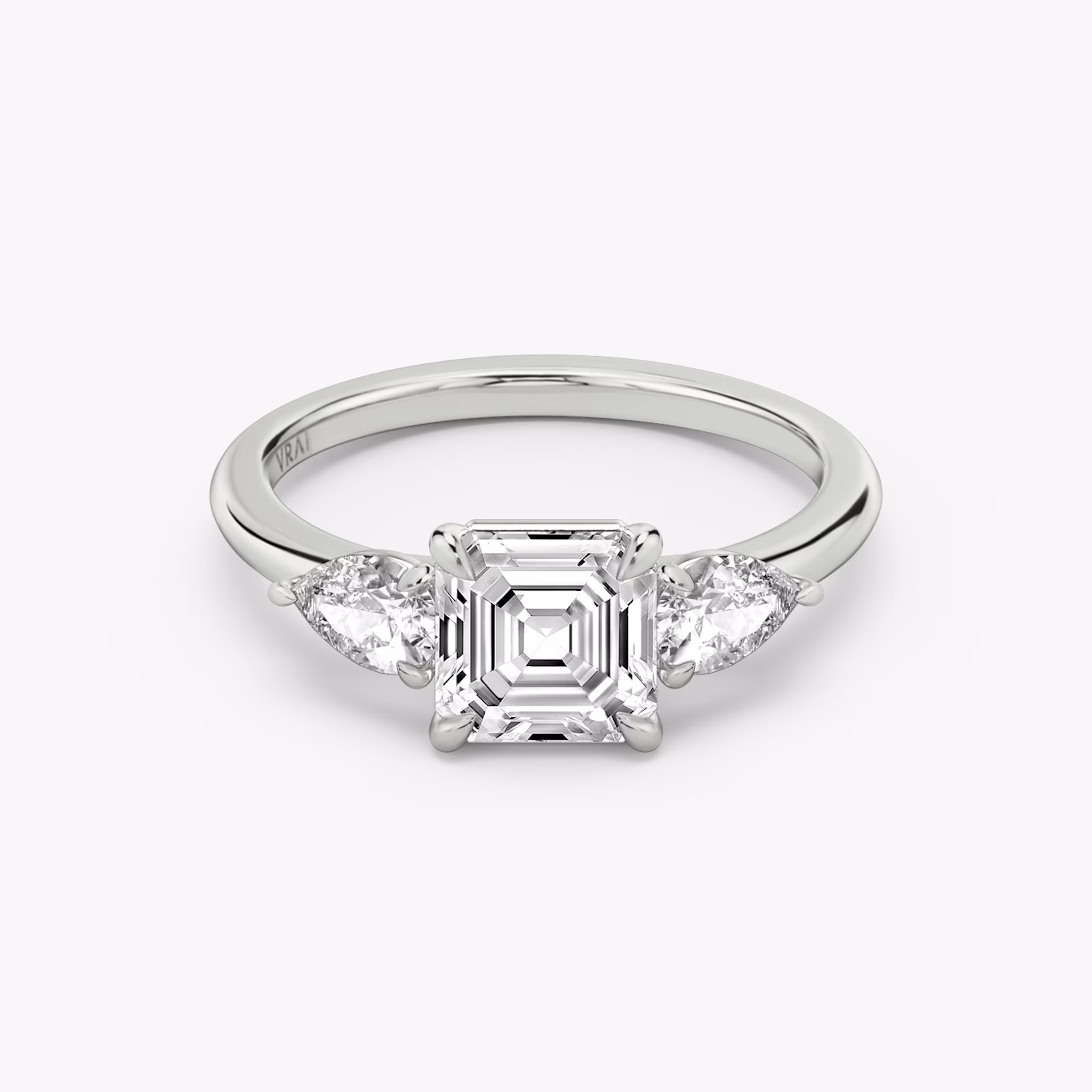 The Three Stone | Asscher | Platinum | bandAccent: Plain | sideStoneCarat: 0.25ct | sideStoneShape: Pear | diamondOrientation: vertical | caratWeight: other