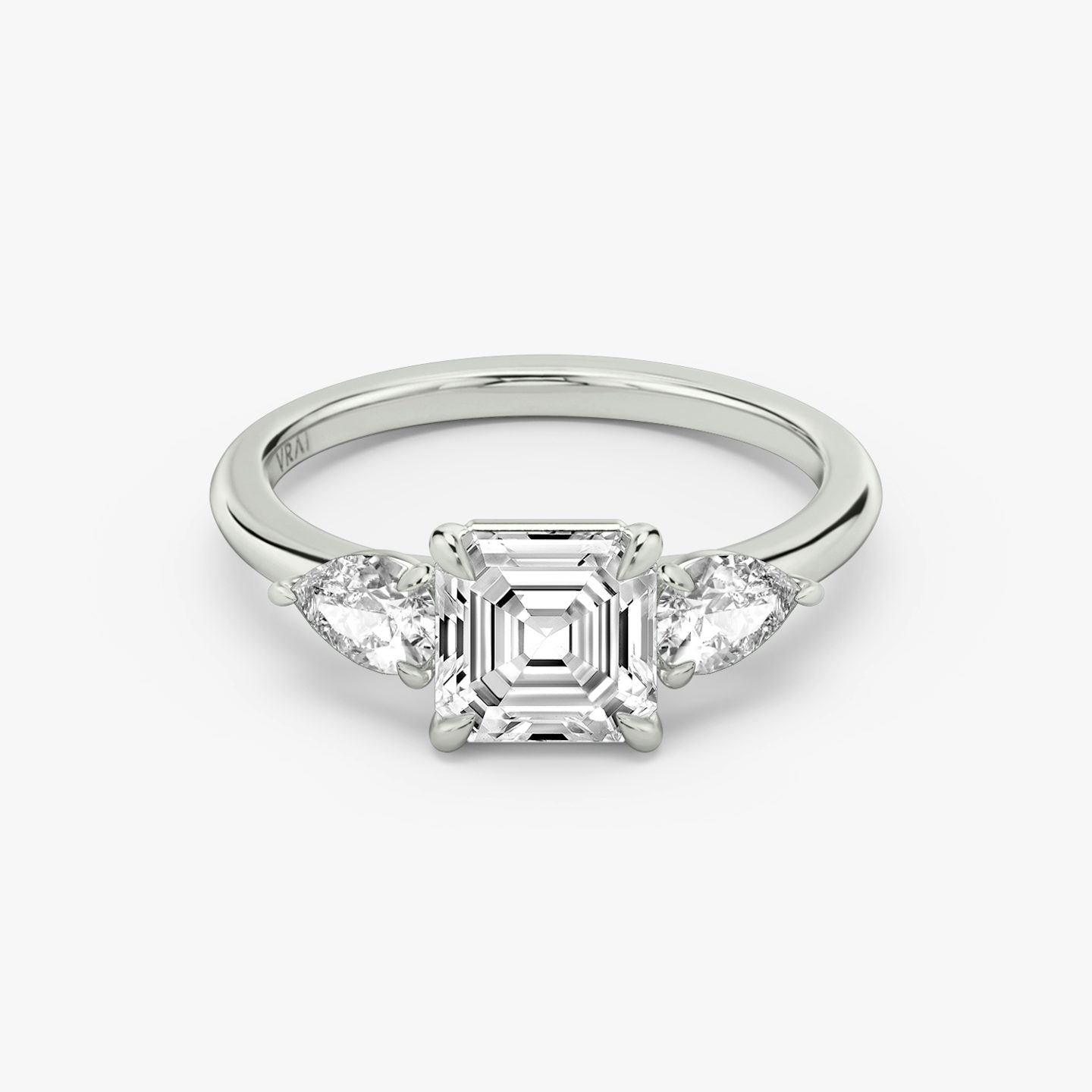 The Three Stone | Asscher | 18k | White Gold | bandAccent: Plain | sideStoneCarat: 0.25ct | sideStoneShape: Pear | diamondOrientation: vertical | caratWeight: other