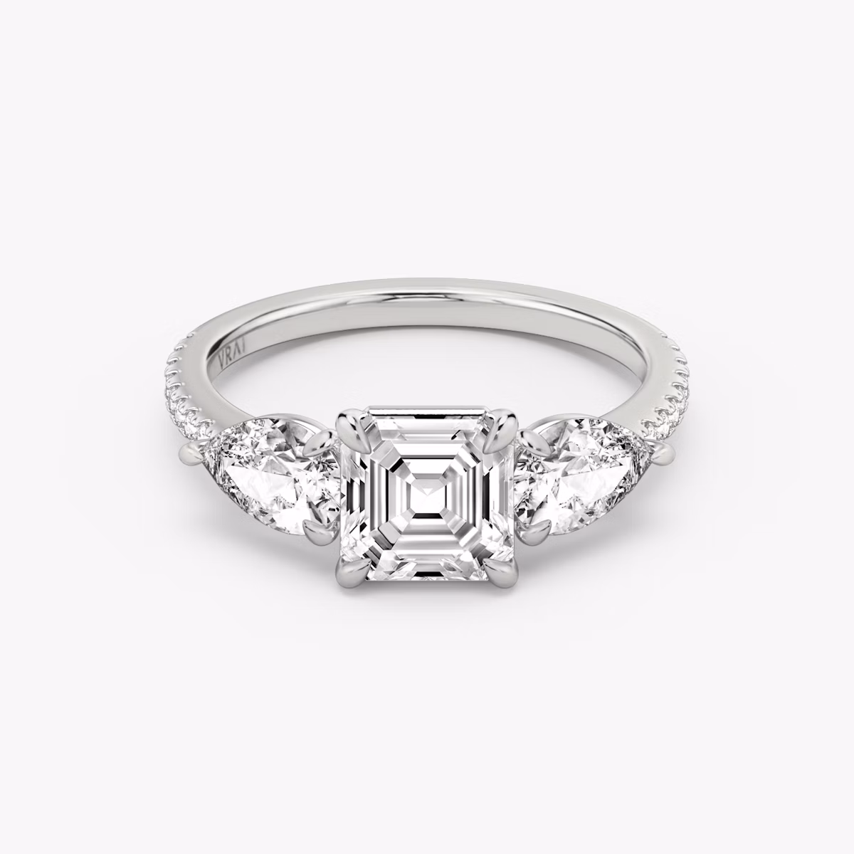 The Three Stone | Asscher | Platinum | bandAccent: Pavé | sideStoneCarat: 0.50ct | sideStoneShape: Pear | diamondOrientation: vertical | caratWeight: other