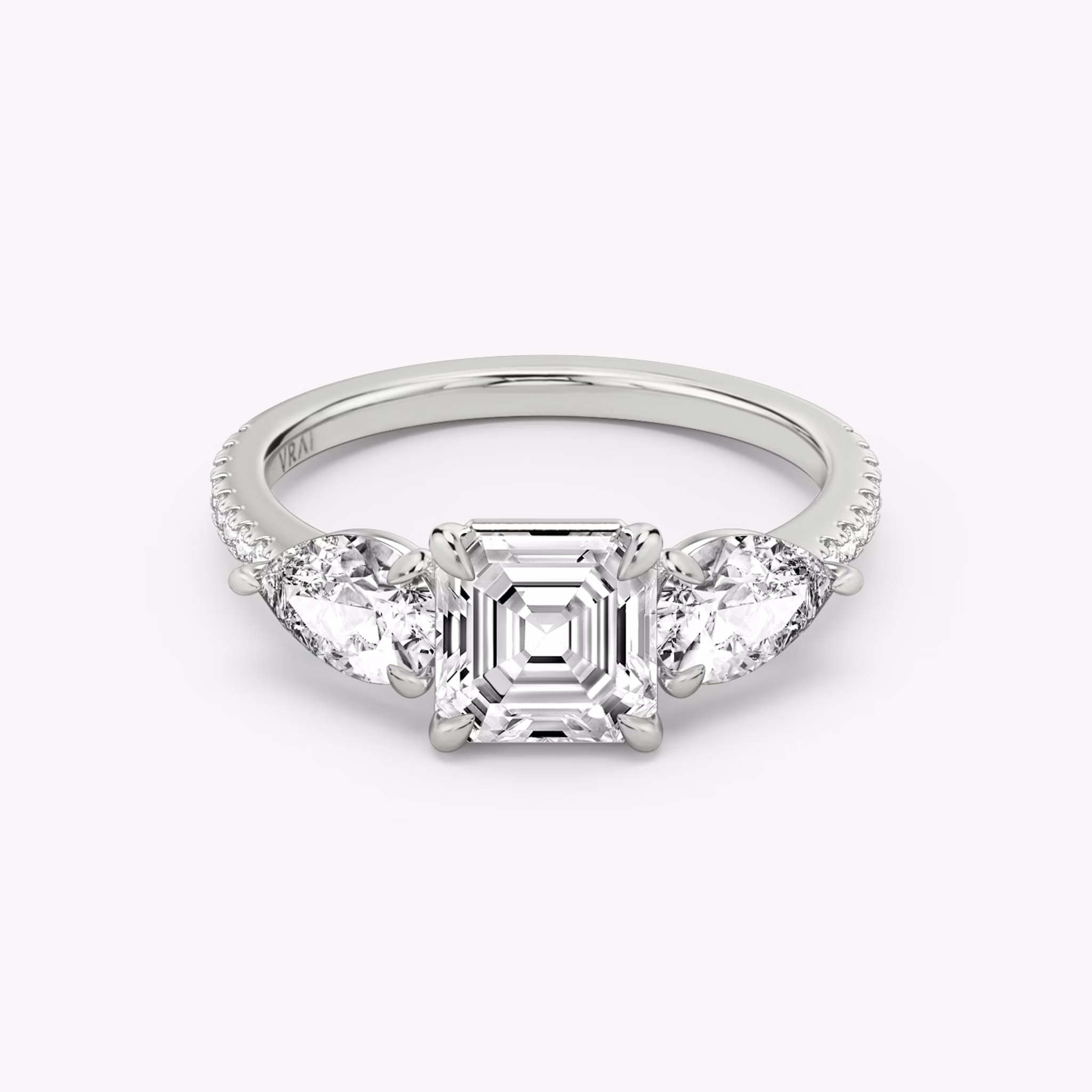 The Three Stone | Asscher | 18k | White Gold | bandAccent: Pavé | sideStoneCarat: 0.50ct | sideStoneShape: Pear | diamondOrientation: vertical | caratWeight: other