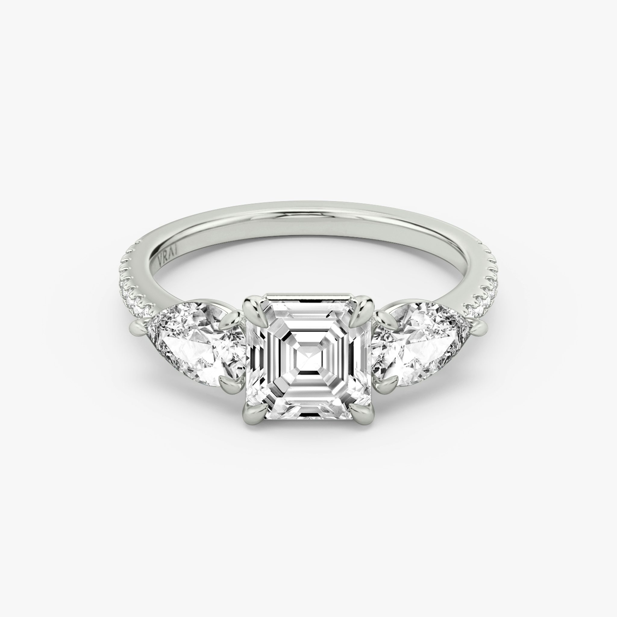 The Three Stone | Asscher | 18k | White Gold | bandAccent: Pavé | sideStoneCarat: 0.50ct | sideStoneShape: Pear | diamondOrientation: vertical | caratWeight: other